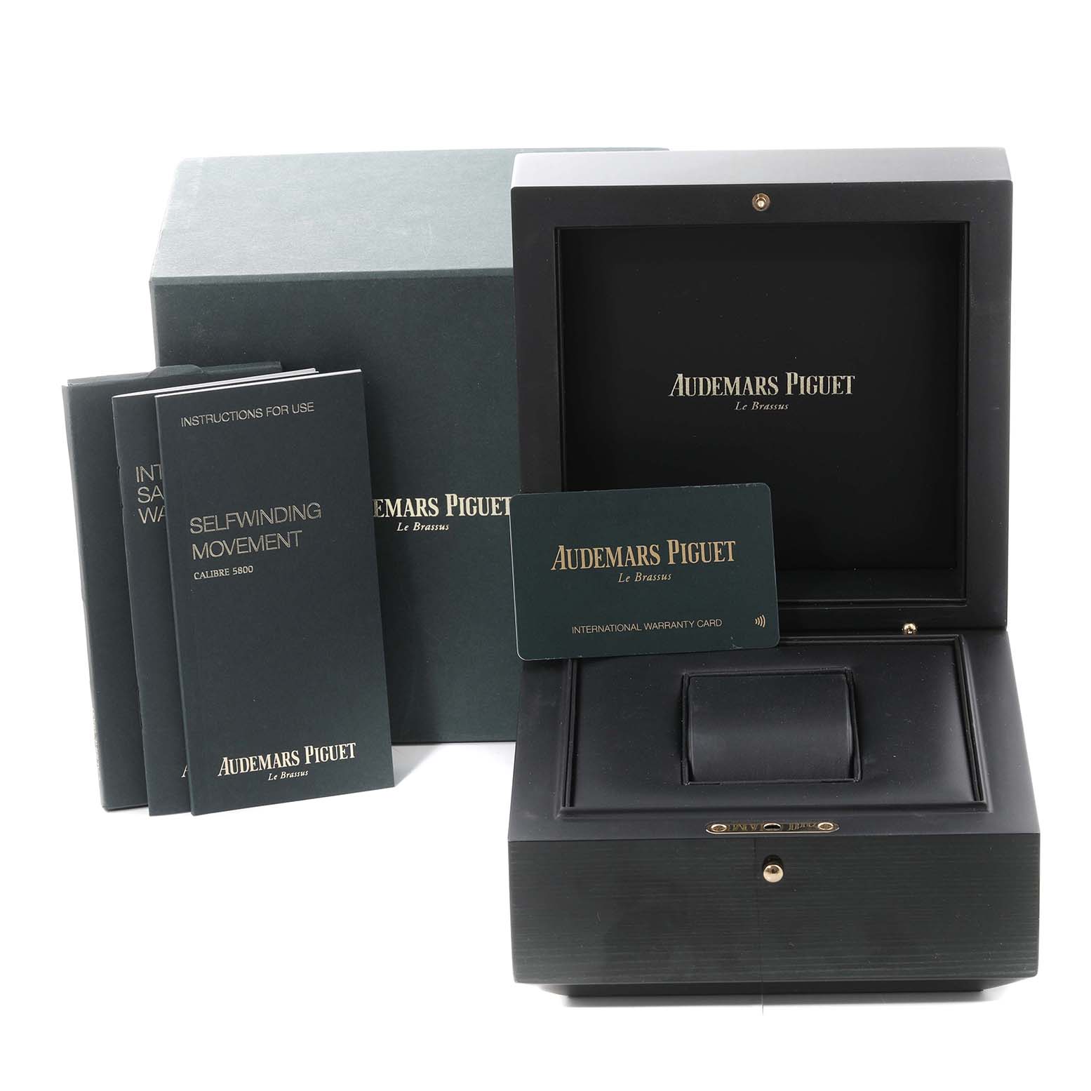 This image shows the packaging, manual, and warranty card for the Audemars Piguet Royal Oak 15451ST.ZZ.1256ST.03 Men's Stainless Steel Blue Dial 15451ST.ZZ.1256ST.03 Men's Stainless Steel Blue Dial watch.