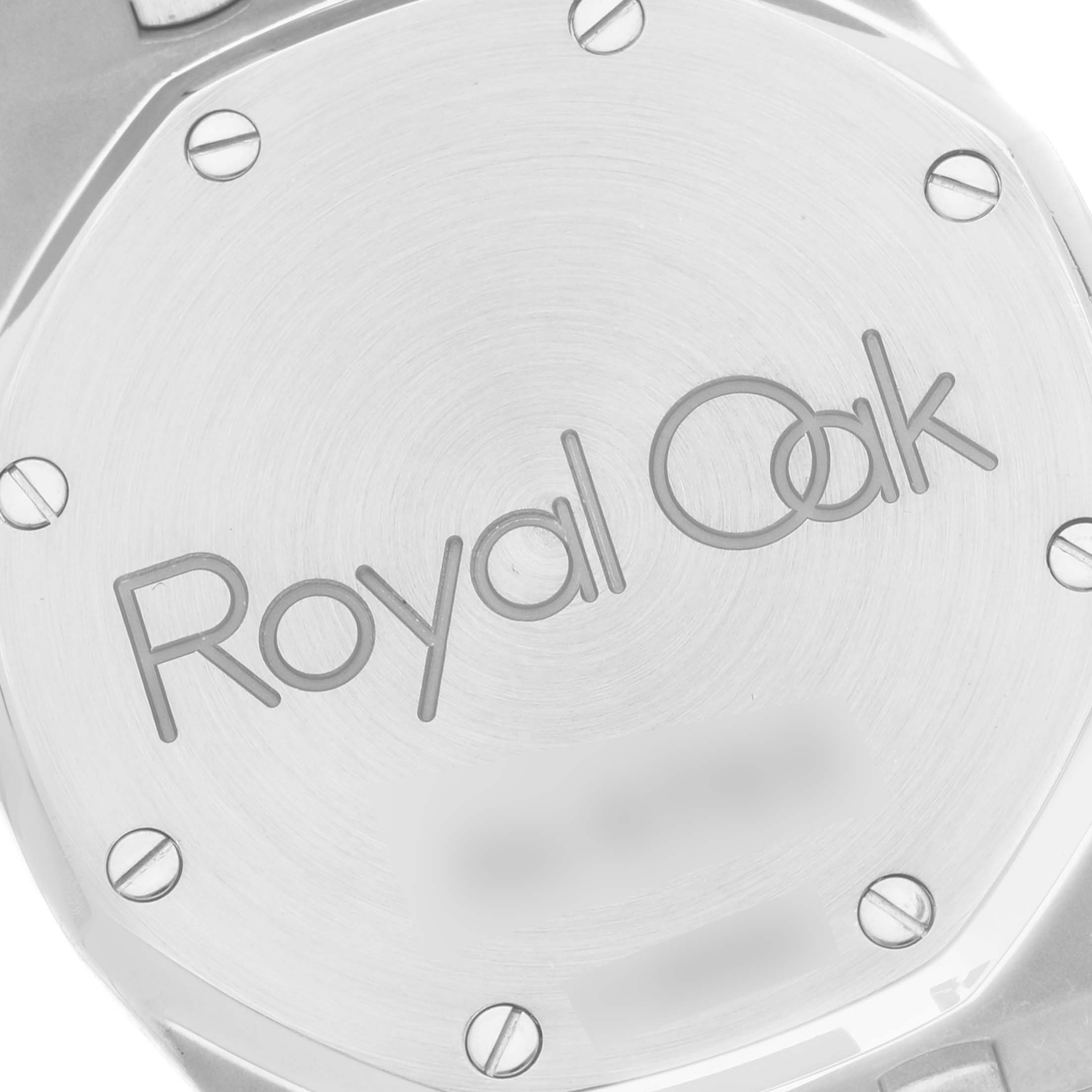 The image shows the back case of a Royal Oak model watch by Audemars Piguet with visible screws and logo engraving.