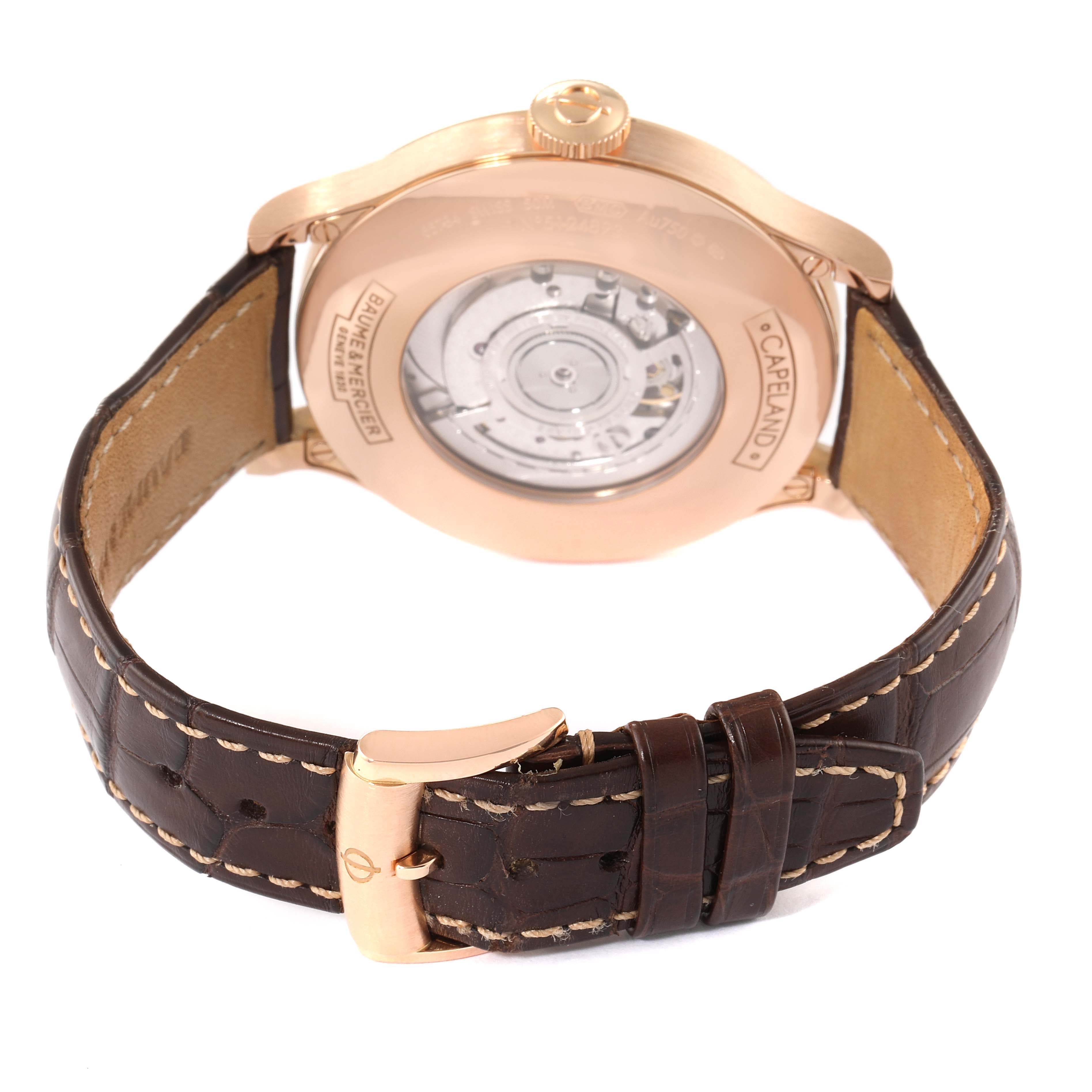 This image shows the back view of a Capeland model by Baume & Mercier, highlighting its movement and leather strap.