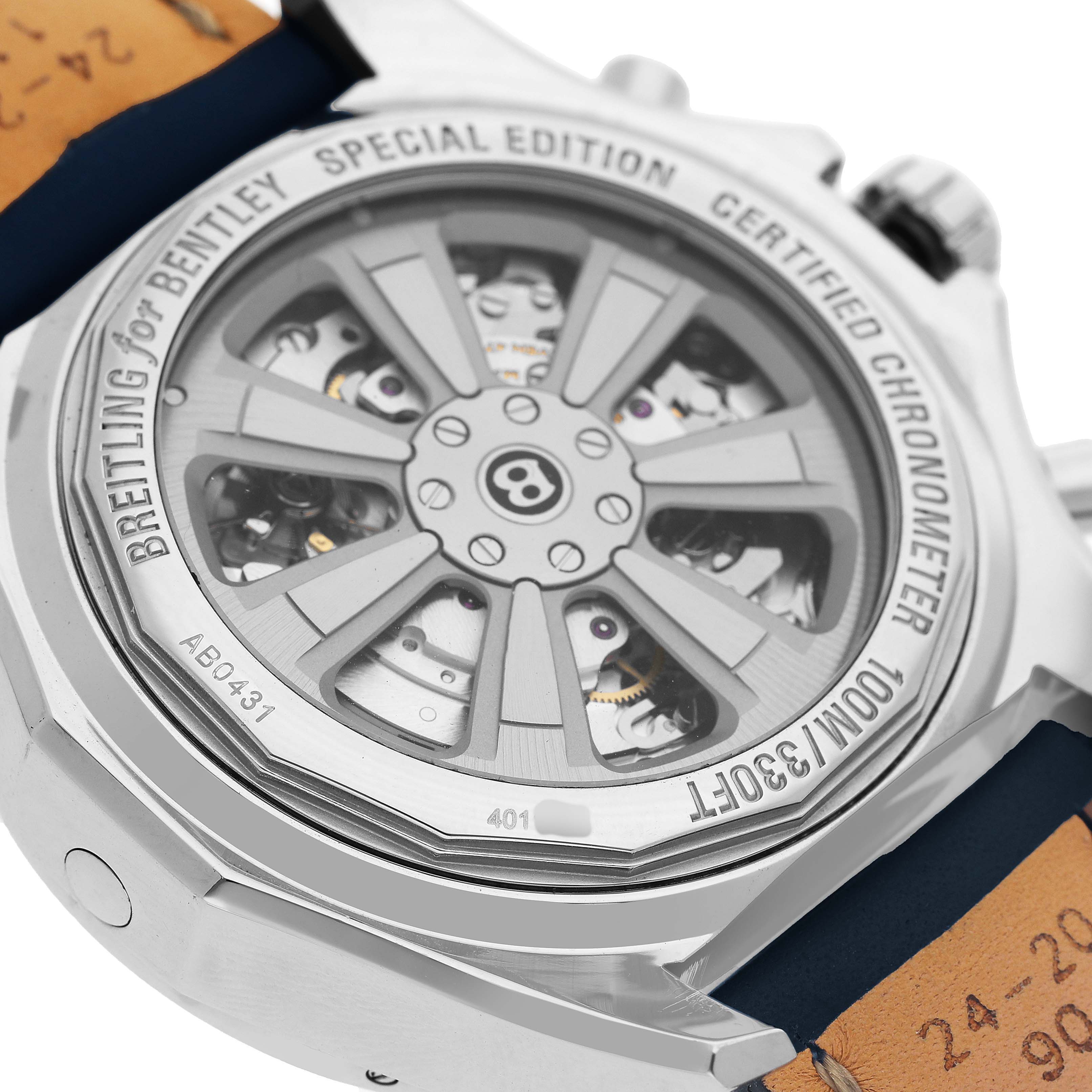 The image shows the case back of a Bentley model by Breitling, featuring its intricate mechanical movement and signature details.