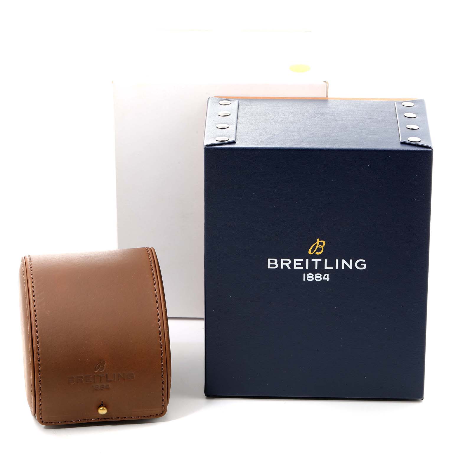 This image shows the packaging and carrying case for the Bentley model by Breitling, including a navy box and brown leather case.