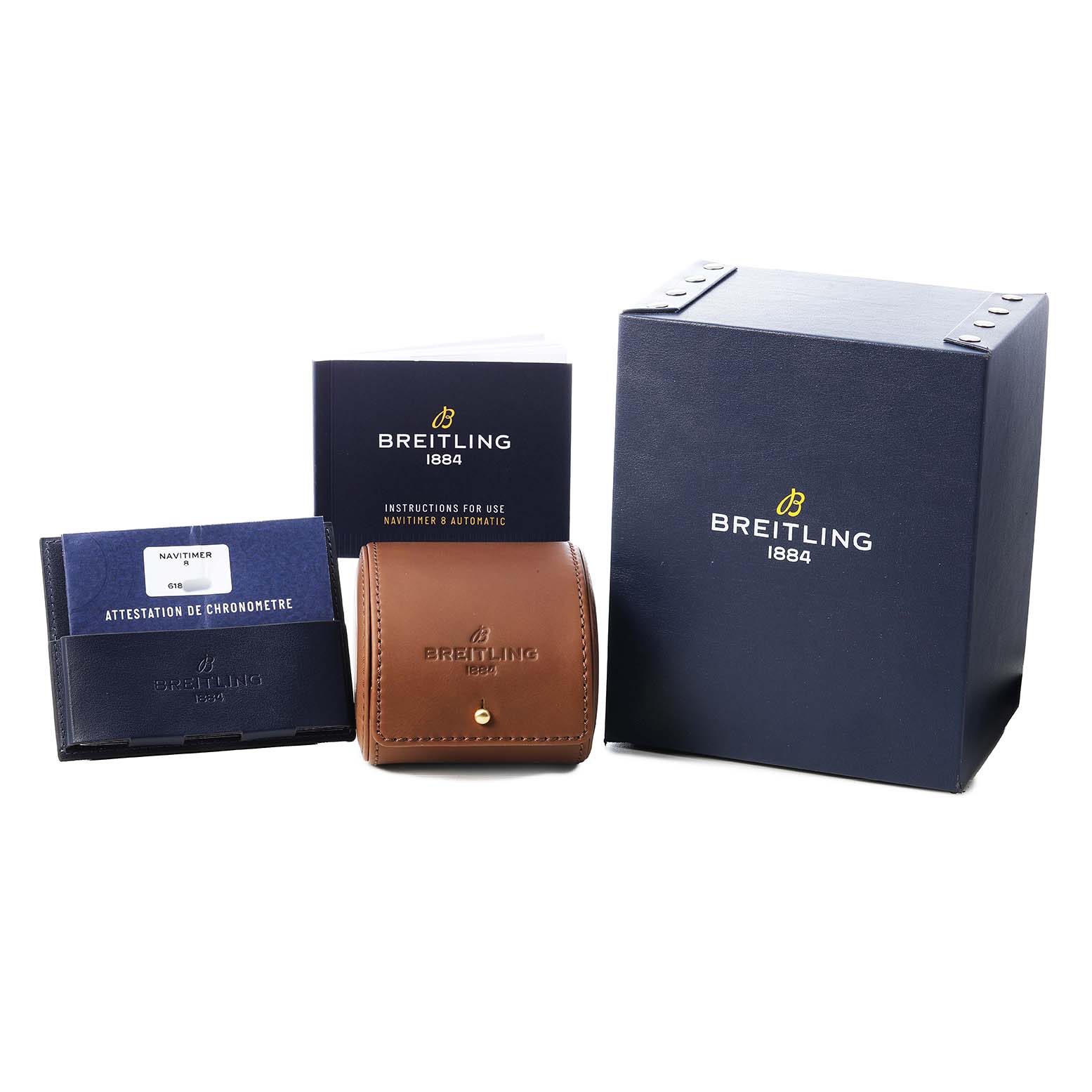 The image shows the Breitling Navitimer M17314 Men's Stainless Steel Black Dial packaging and documentation, including a box, leather case, and manuals.