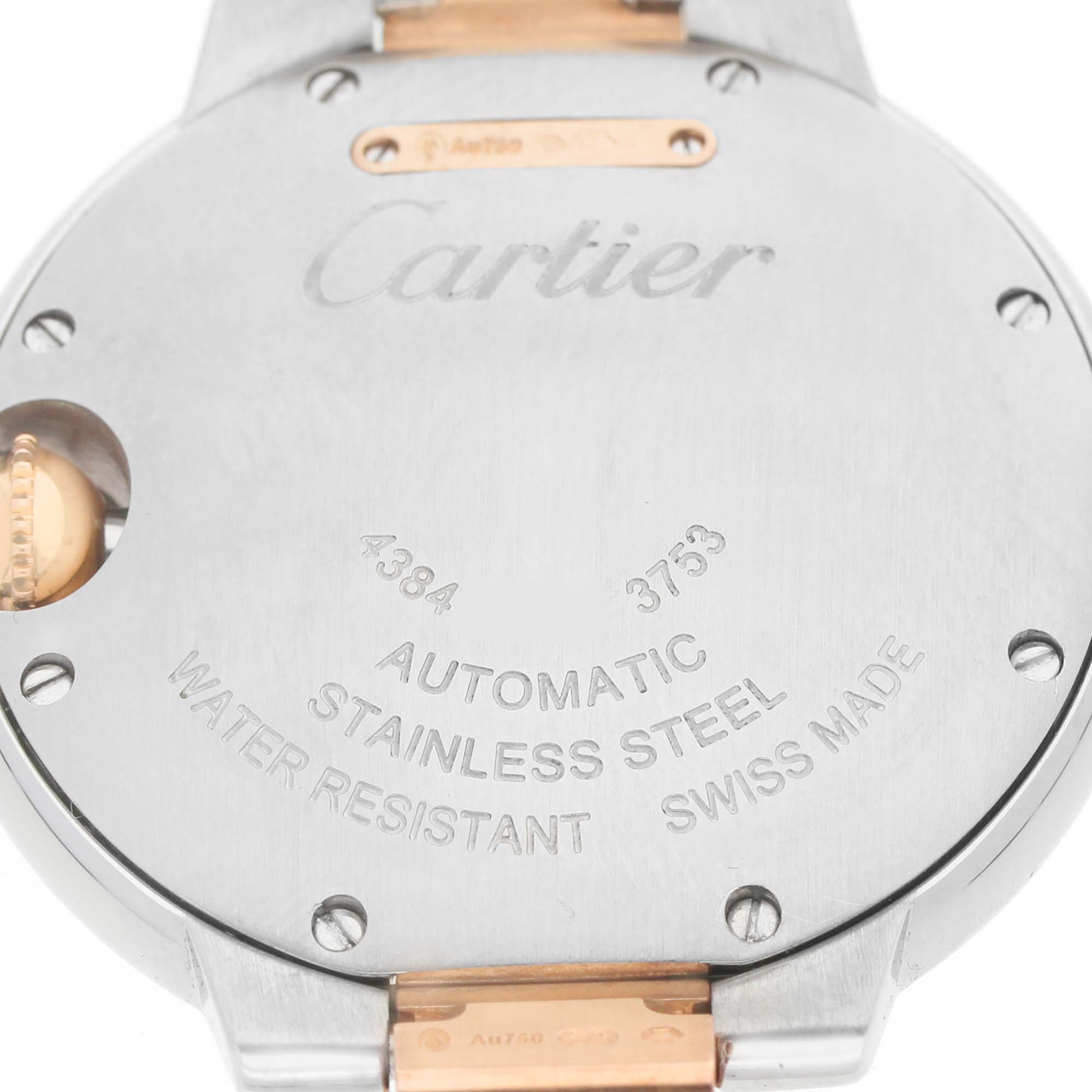 The image shows the back case of a Cartier Ballon Bleu W3BB0006 Women's Steel and Gold (two tone) Silver Dial watch, highlighting the engravings and metal details.