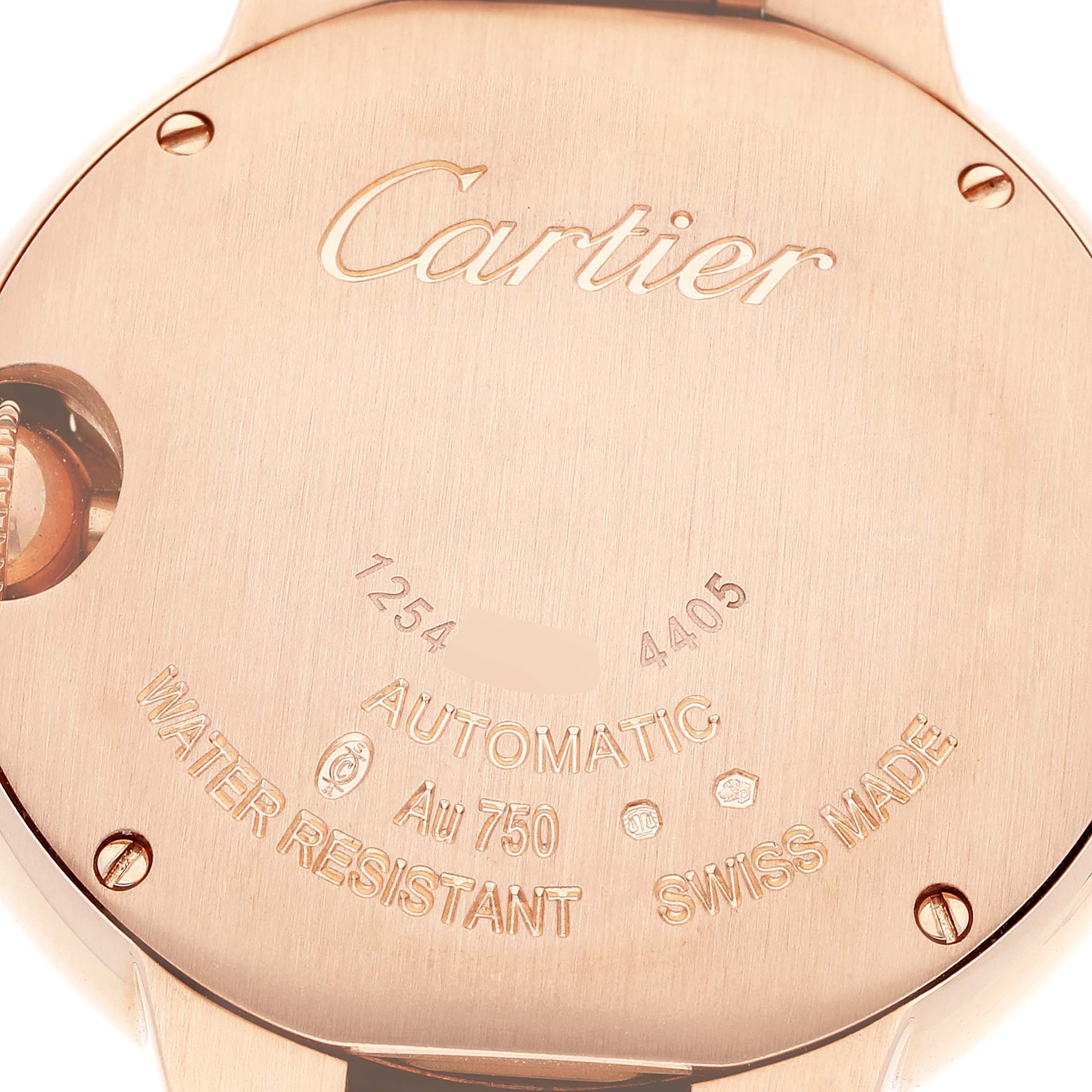 This image shows the back case of a Cartier Ballon Bleu WGBB0042 Women's Rose Gold Silver Dial WGBB0042 Women's Rose Gold Silver Dial watch, highlighting the brand name, specifications, and serial numbers.