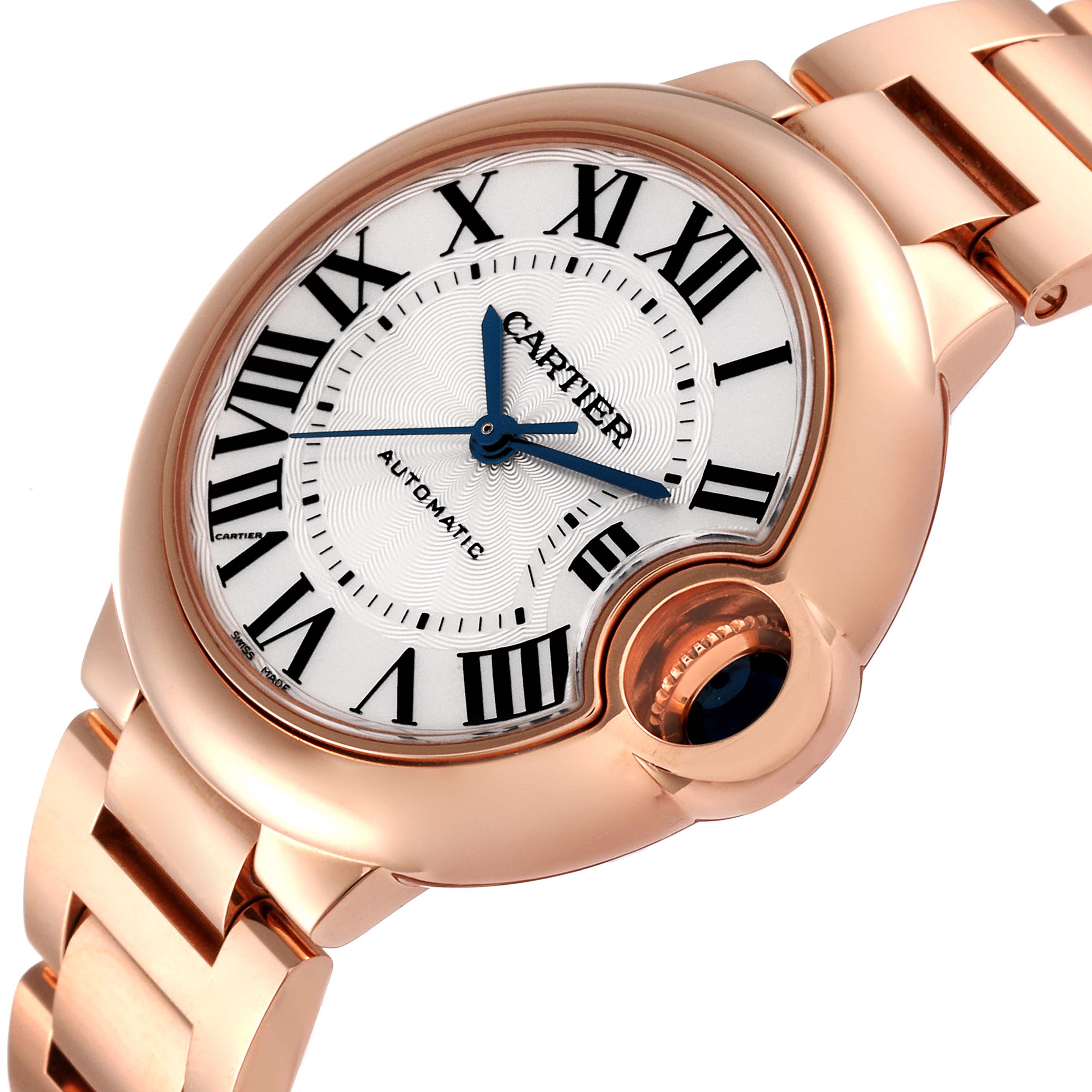 The Ballon Bleu by Cartier watch is shown from an angled top view, displaying its round face, Roman numerals, blue hands, crown, and metal bracelet.