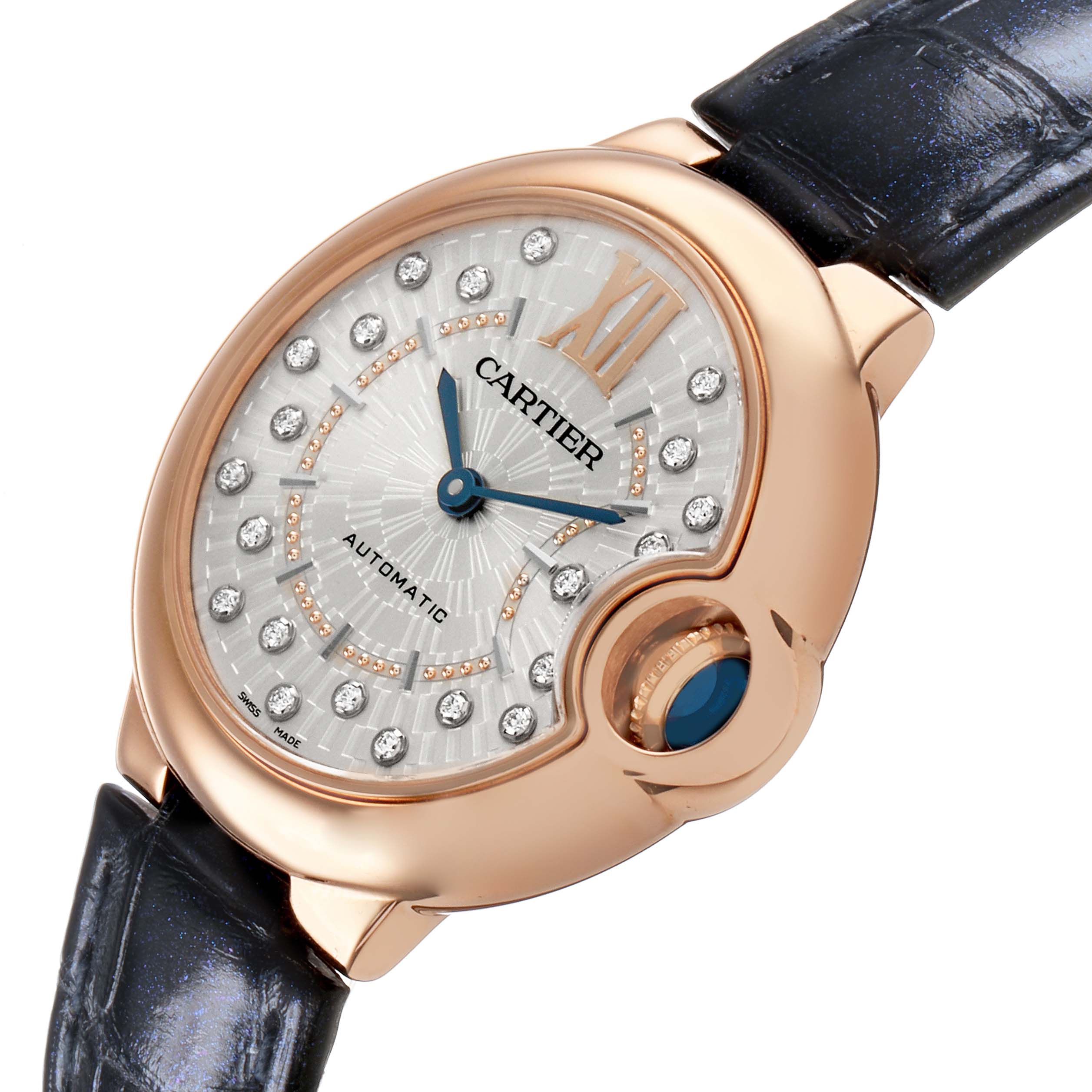 The Cartier Ballon Bleu WGBB0052 Women's Rose Gold Silver Dial watch is shown at an angled view, featuring its rose gold case, diamond dial, and the signature crown with a blue cabochon.