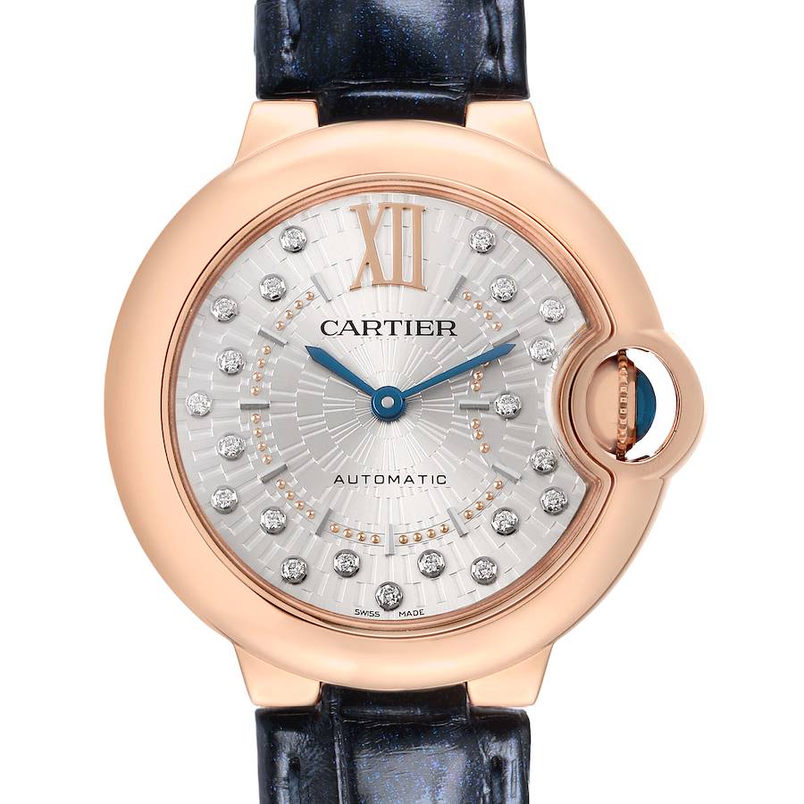The Cartier Ballon Bleu WGBB0052 Women's Rose Gold Silver Dial watch is shown from a front angle, highlighting its rose gold case, diamond hour markers, and blue hands.