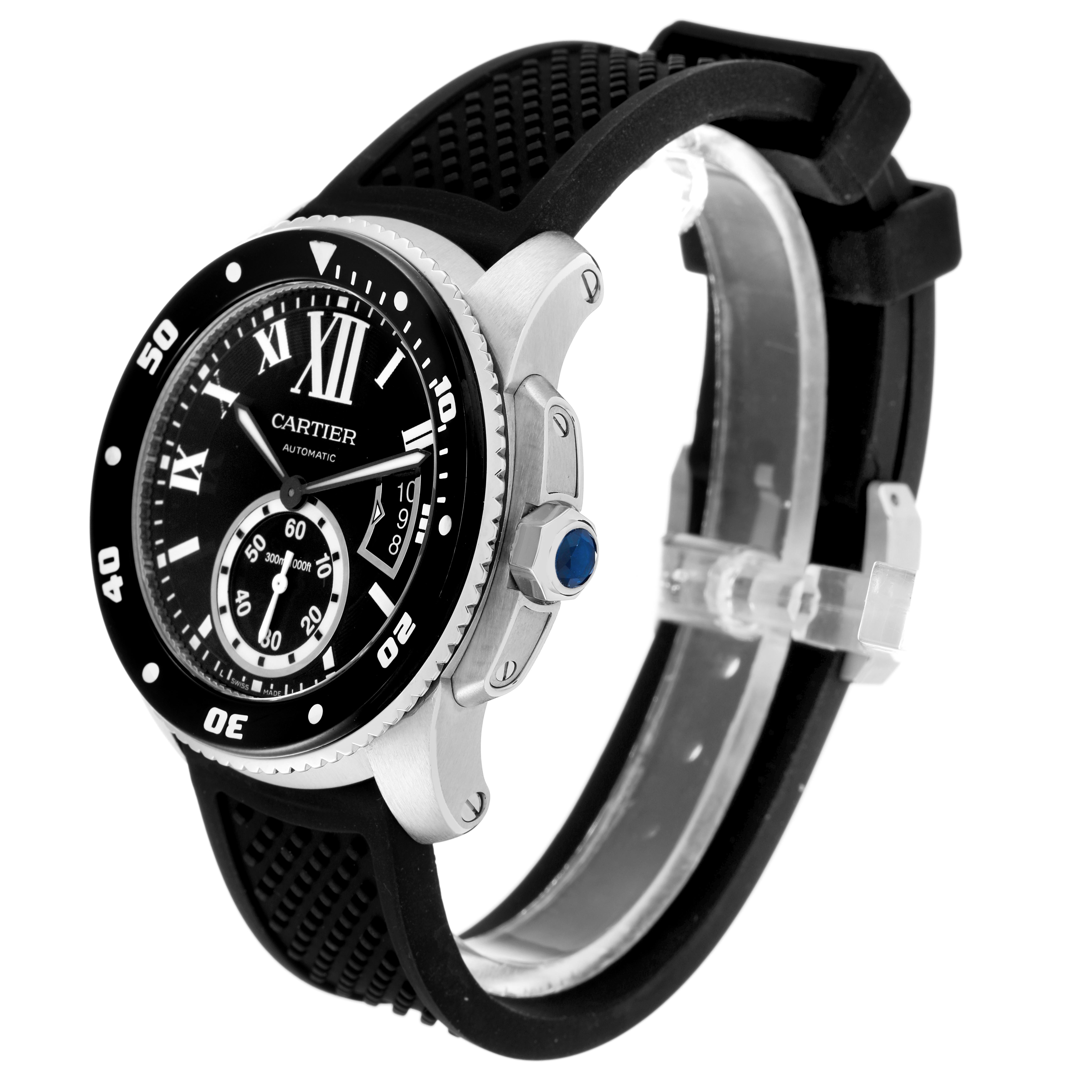 The Calibre de Cartier watch is shown from a side angle, highlighting the bezel, dial, rubber strap, and crown.