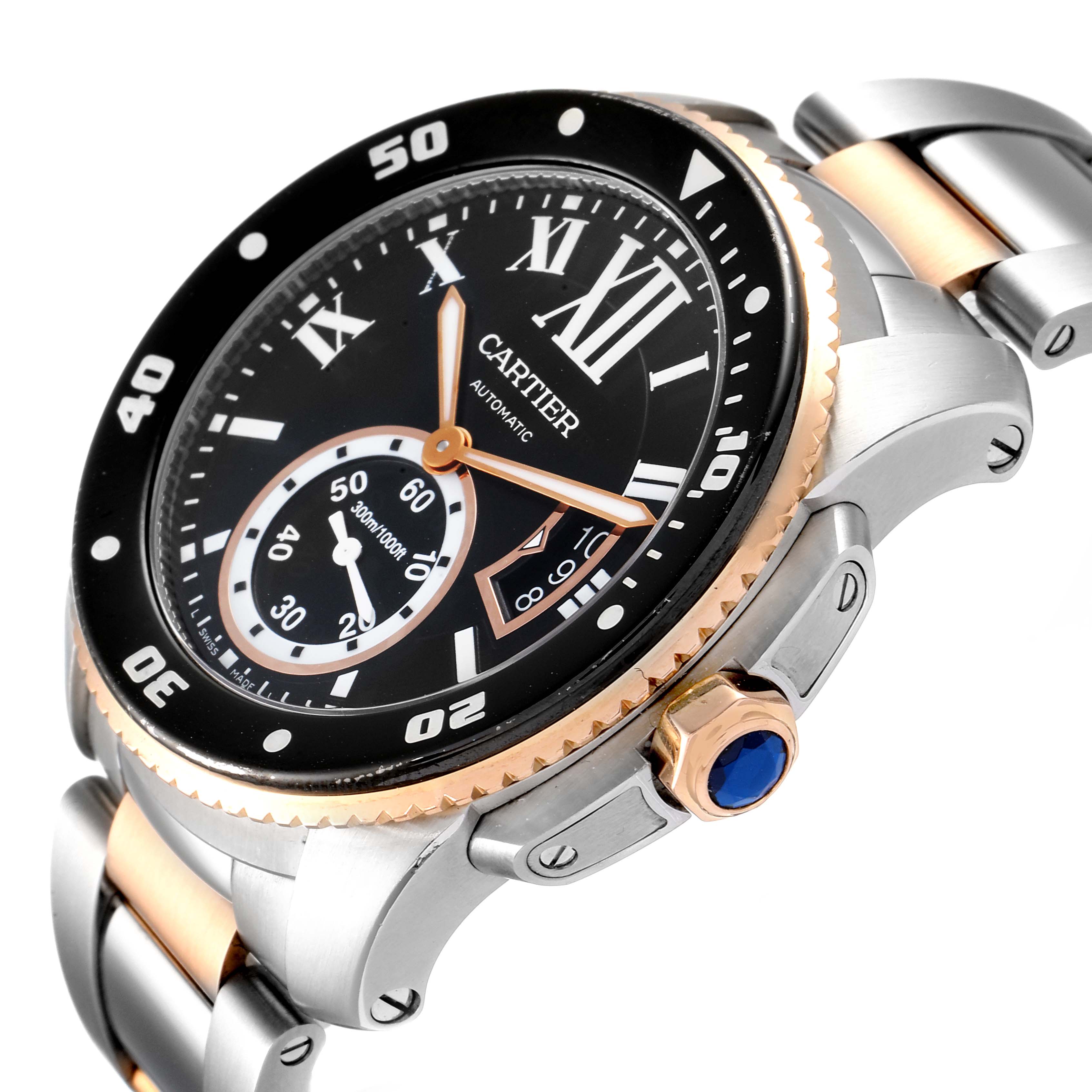 The image shows a Calibre de Cartier watch by Cartier, focusing on the dial, bezel, crown, and part of the bracelet.