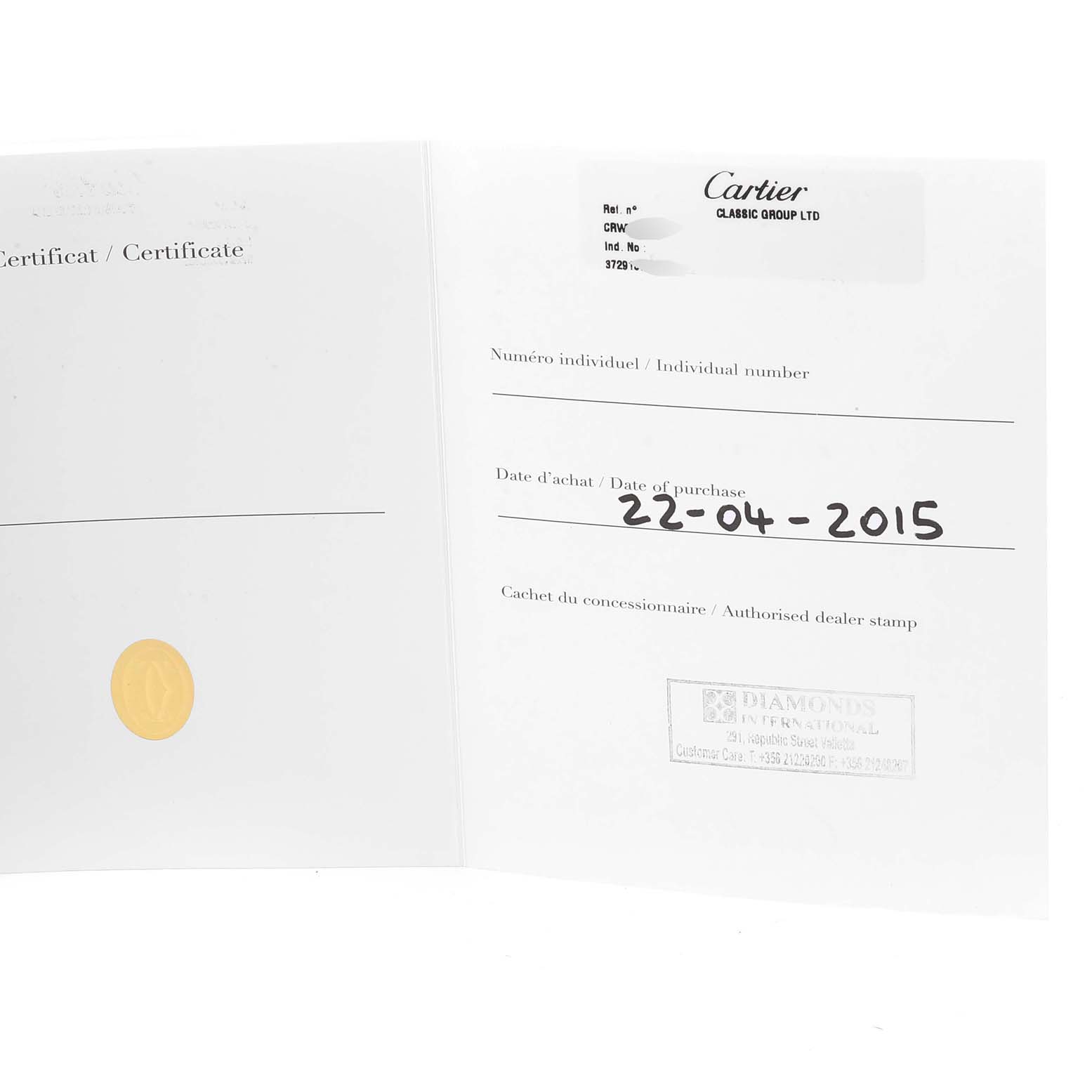 This image shows the open certificate book for the Calibre de Cartier model by Cartier, displaying the date of purchase and dealer's stamp.