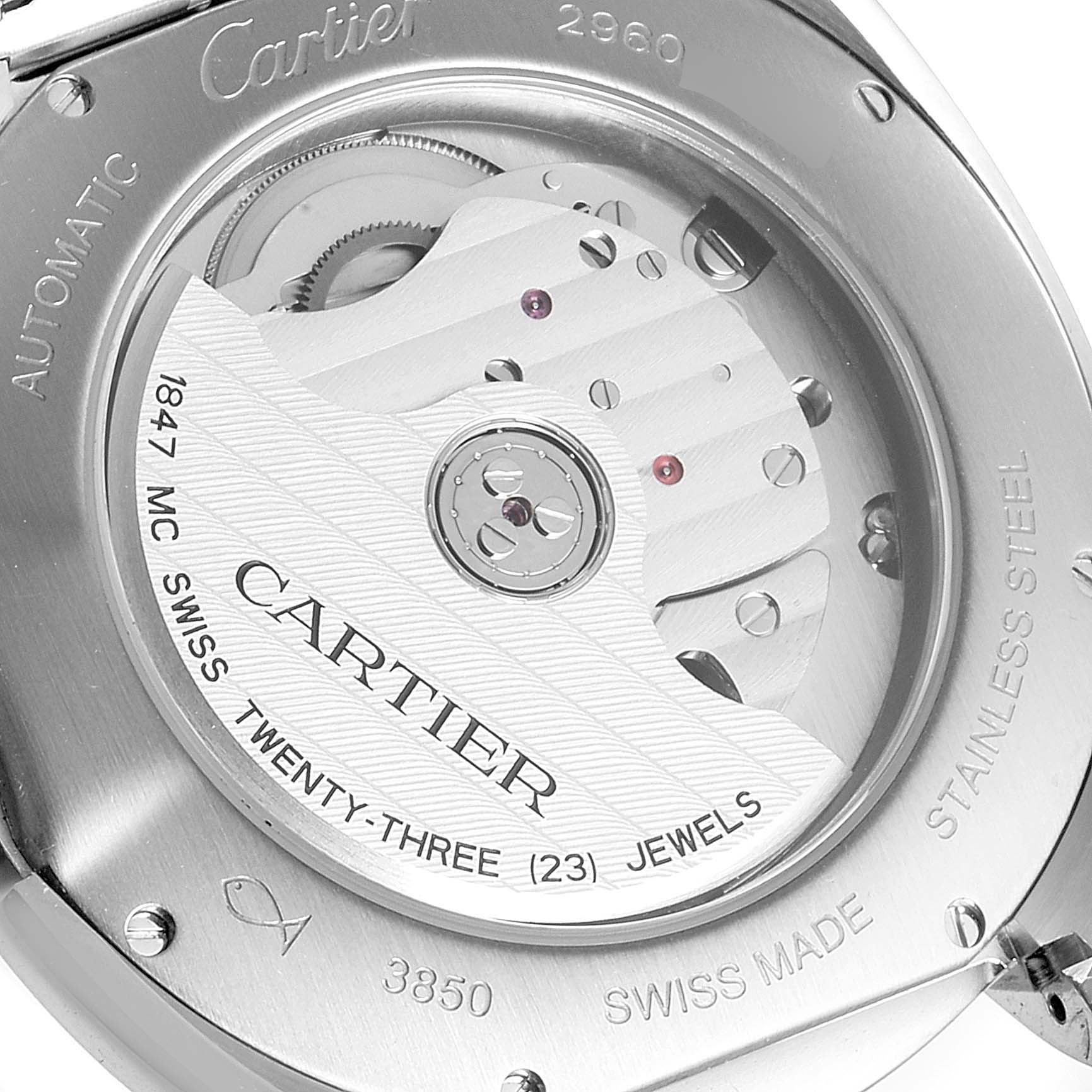 This image shows the back of a Cartier Clé watch, highlighting its automatic movement and internal mechanisms.