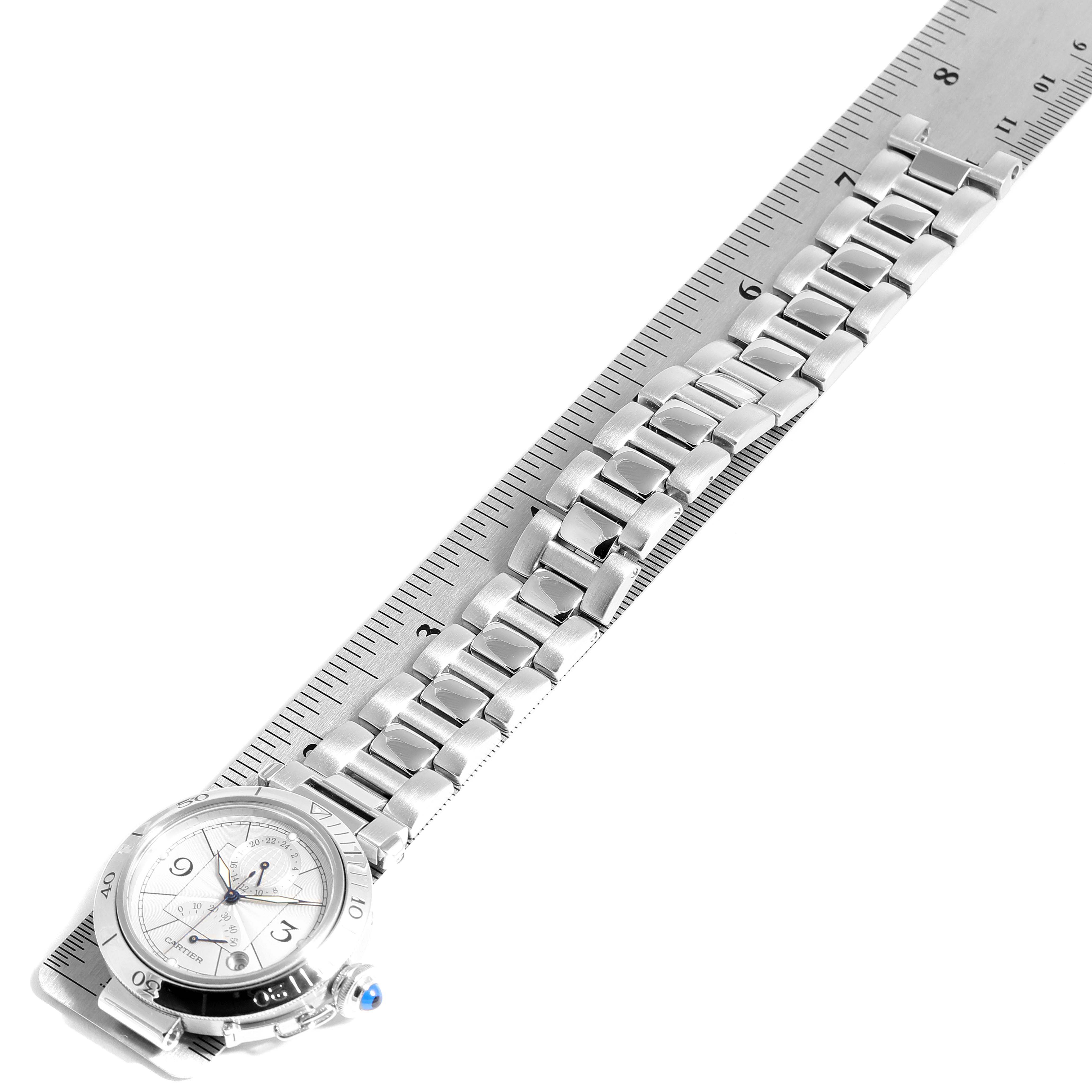 This image shows a Cartier Pasha W31037H3 Men's Stainless Steel Silver Dial W31037H3 Men's Stainless Steel Silver Dial watch laid flat with the full bracelet and face visible, positioned next to a ruler.