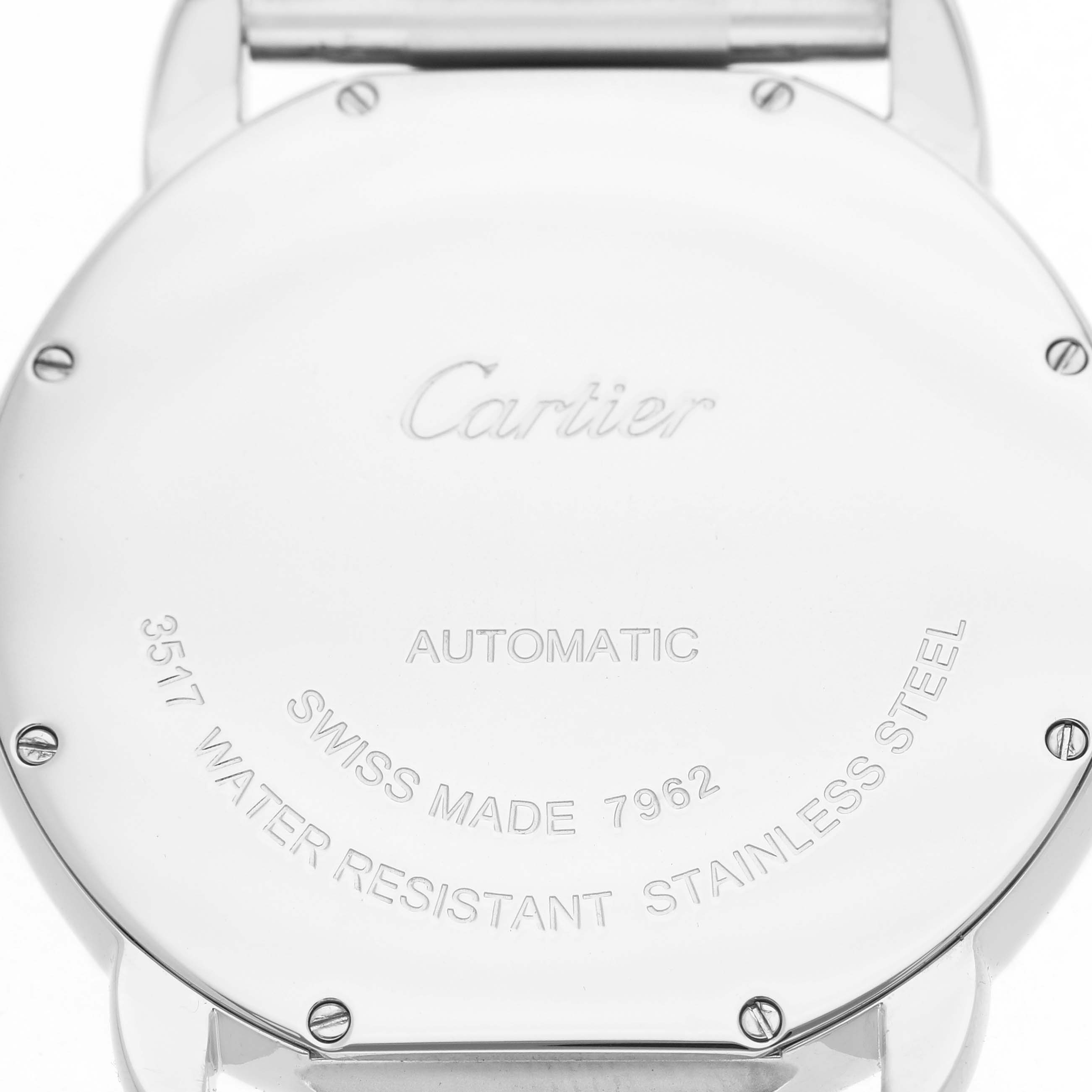 The image shows the back of the Cartier Ronde W6701011 Men's Stainless Steel Silver Dial watch, displaying engravings and screws.