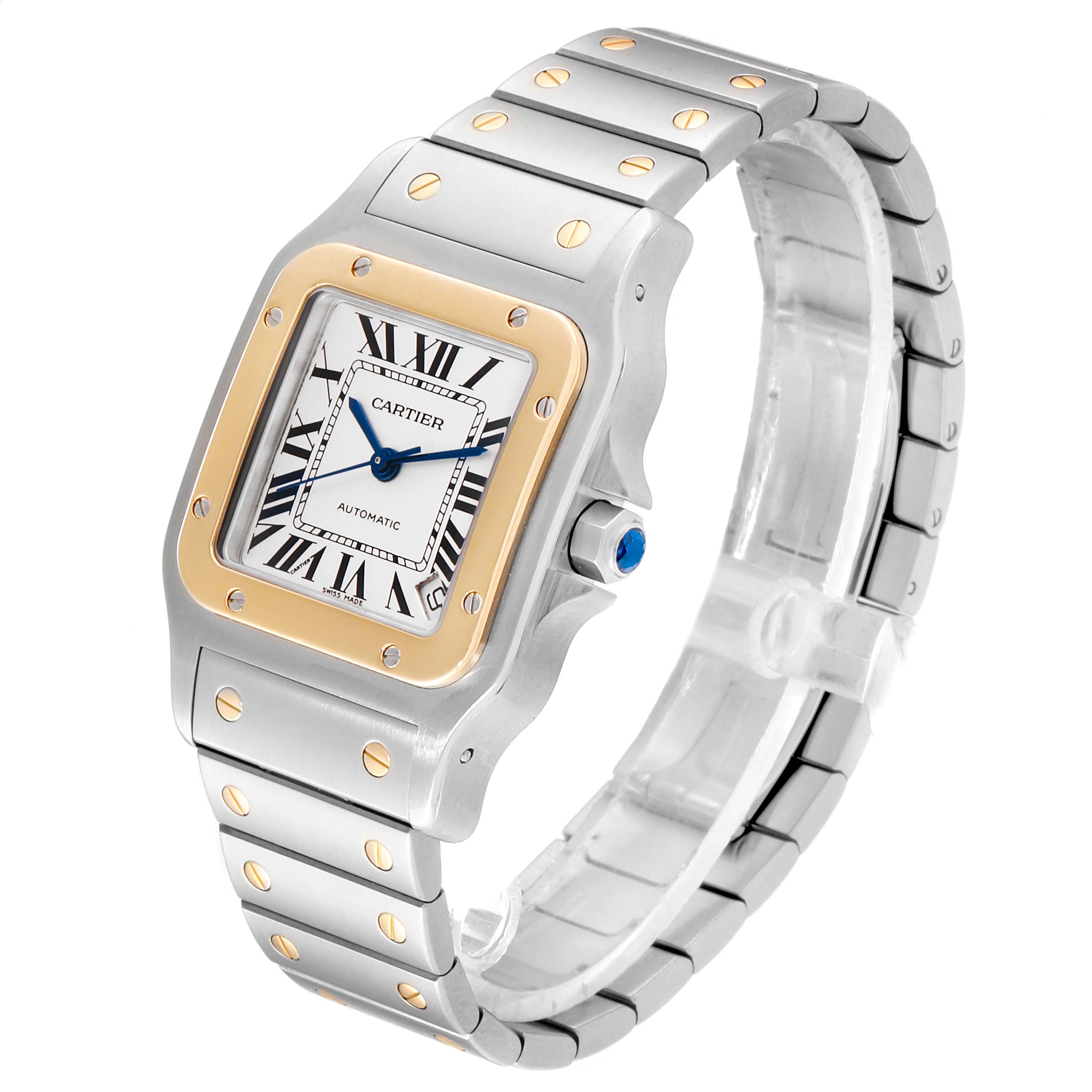 The Cartier Santos W20099C4 Men
s Steel and Gold (two tone) Silver Dial W20099C4 Men
s Steel and Gold (two tone) Silver Dial watch is shown at a three-quarter angle, displaying the face with Roman numerals, bezel, and metallic bracelet.