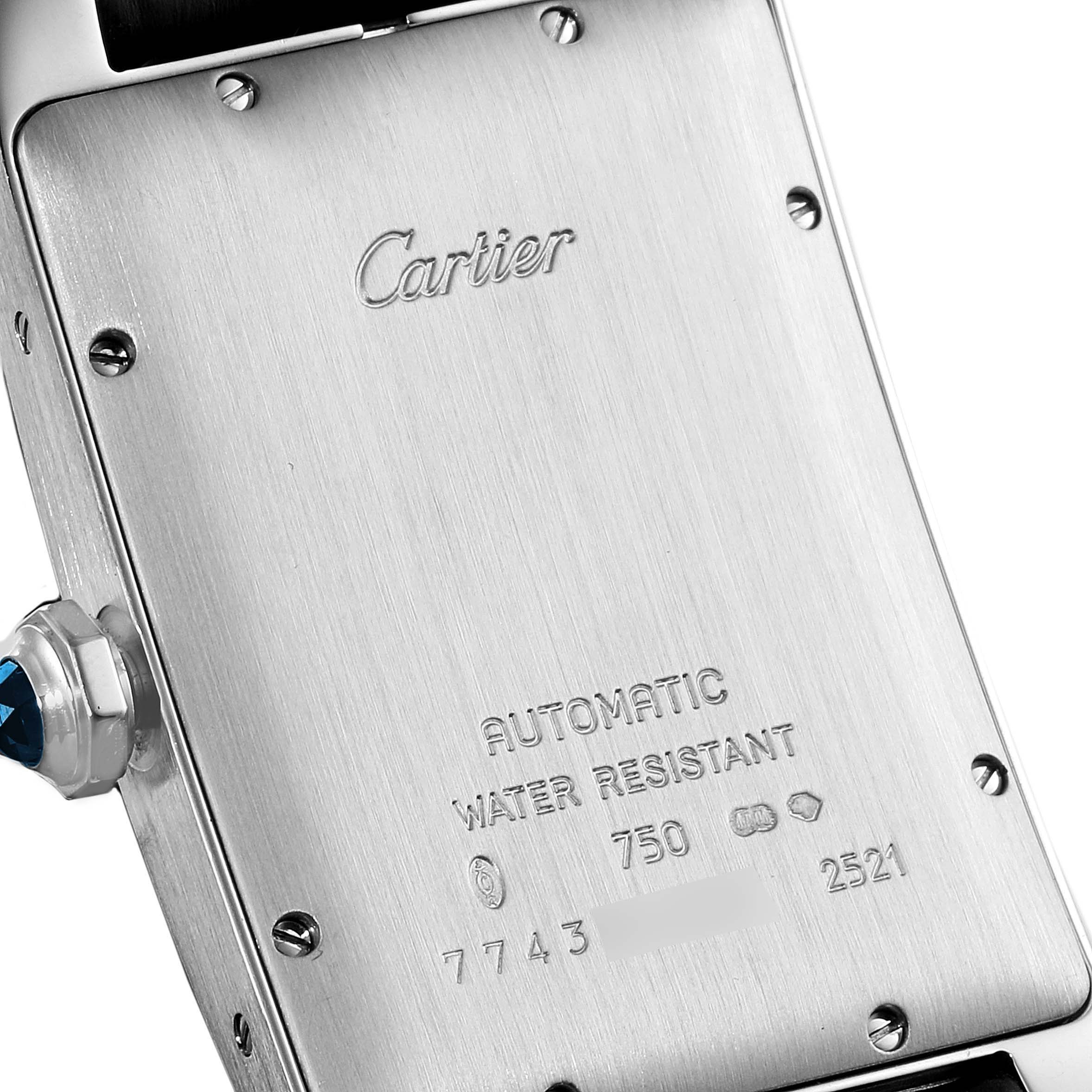 The image shows the back case and crown of a Cartier Tank Américaine watch.