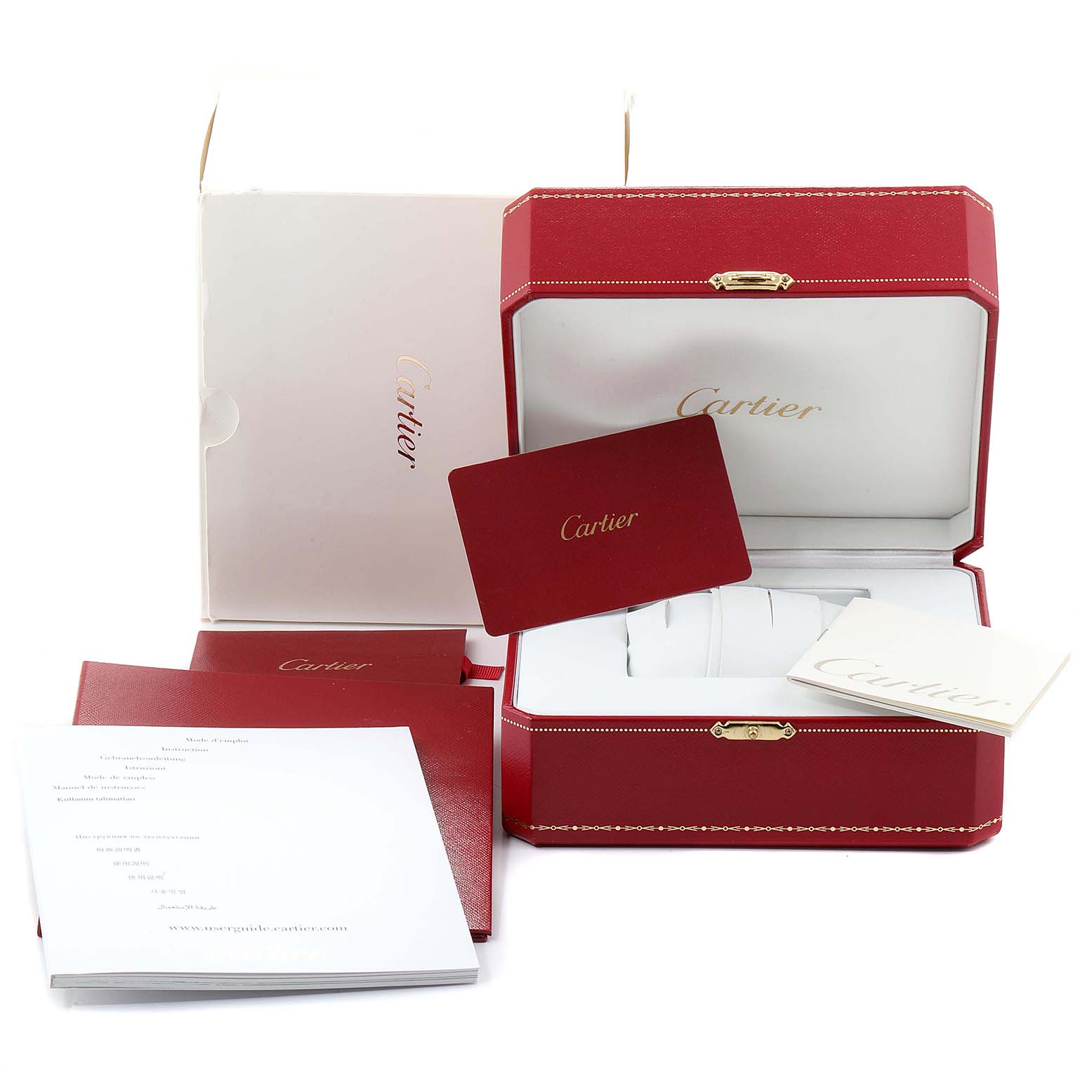 The image shows the packaging and accessories for a Cartier Tank MC W5330003 Men's Stainless Steel Silver Dial W5330003 Men's Stainless Steel Silver Dial watch, including the box, warranty card, and manuals.