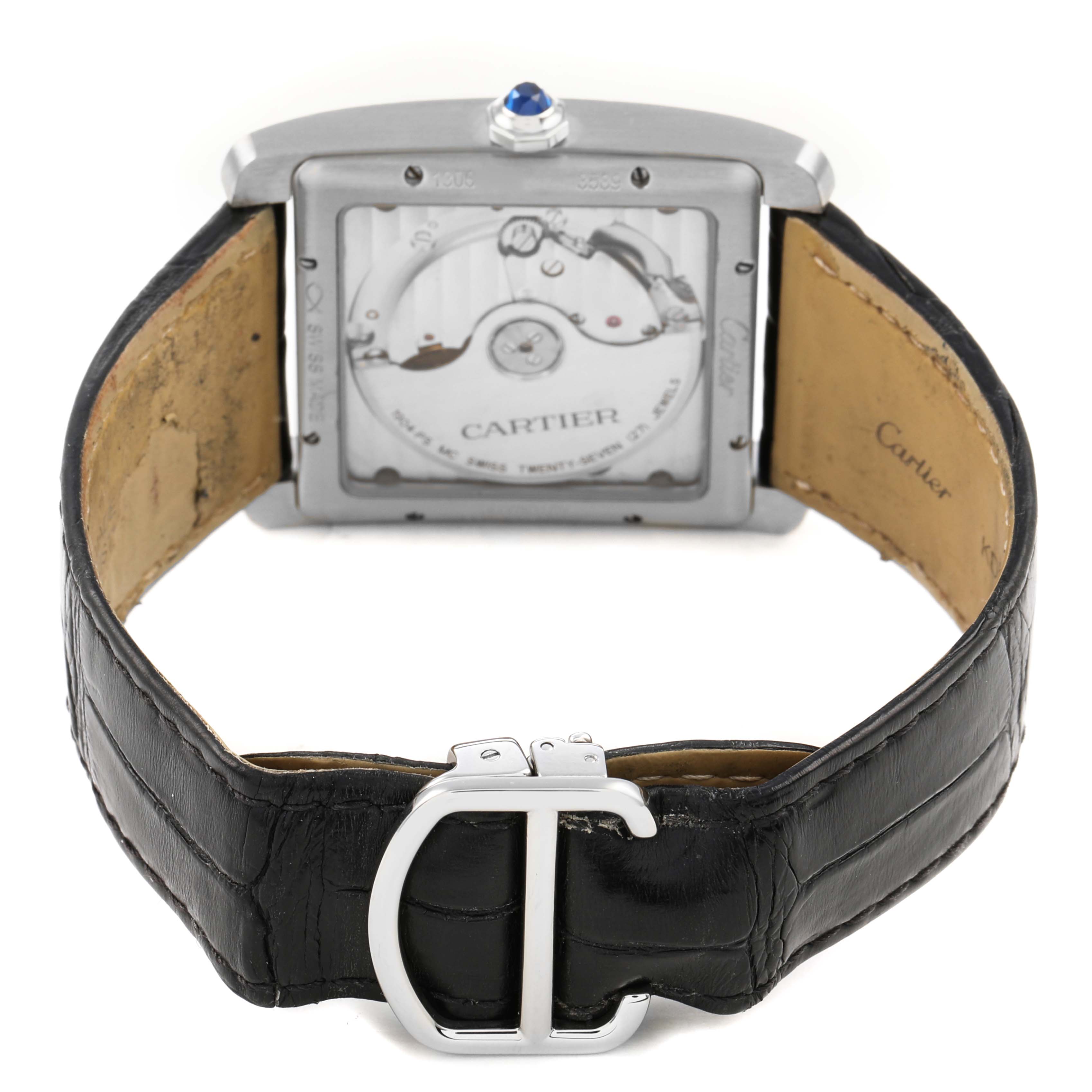 The Cartier Tank MC W5330003 Men's Stainless Steel Silver Dial watch is shown from the back, highlighting the movement, caseback, leather strap, and buckle.
