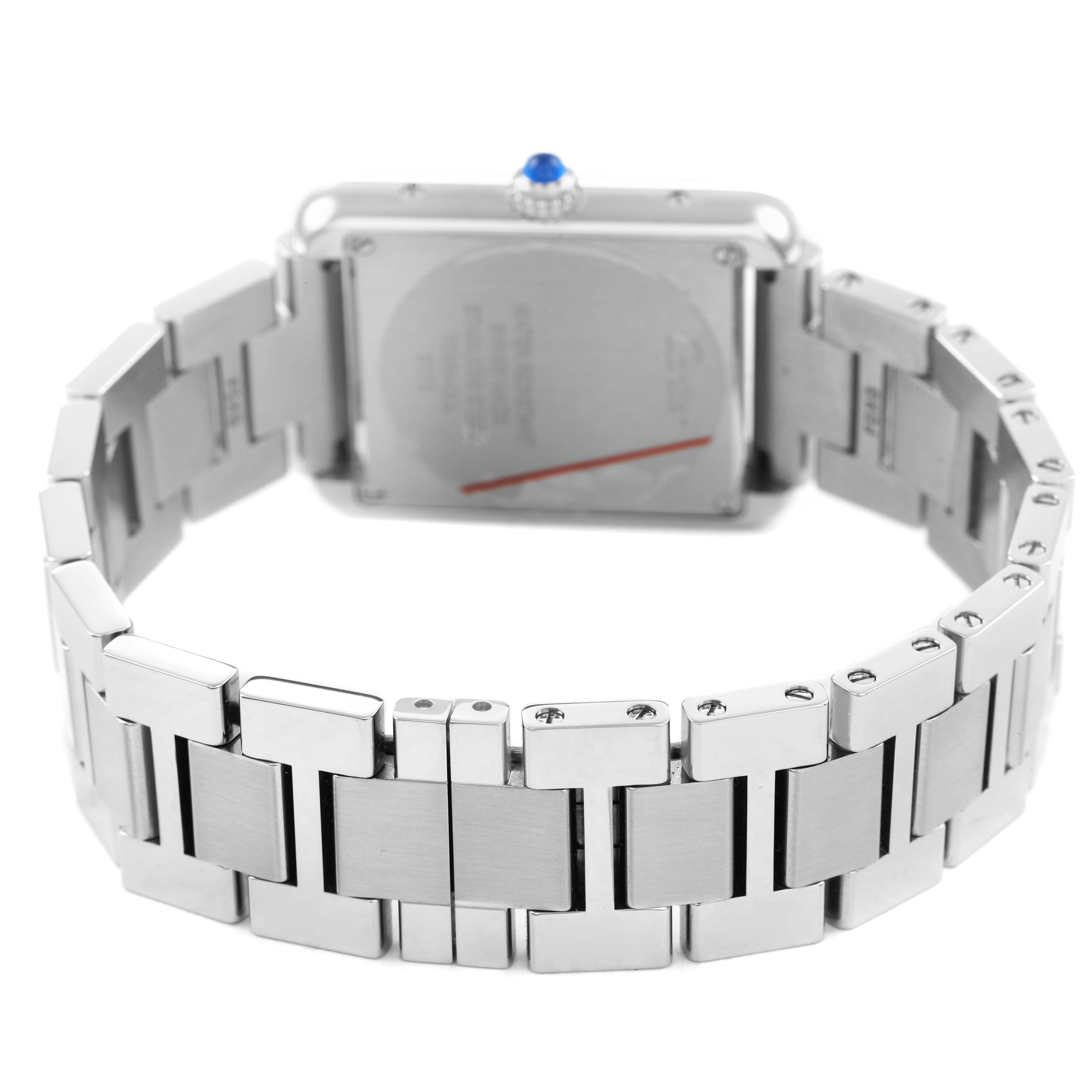 The Cartier Tank Solo W5200013 Women's Stainless Steel Silver Dial watch is shown from the back, highlighting its metal bracelet and case back, with a visible crown.