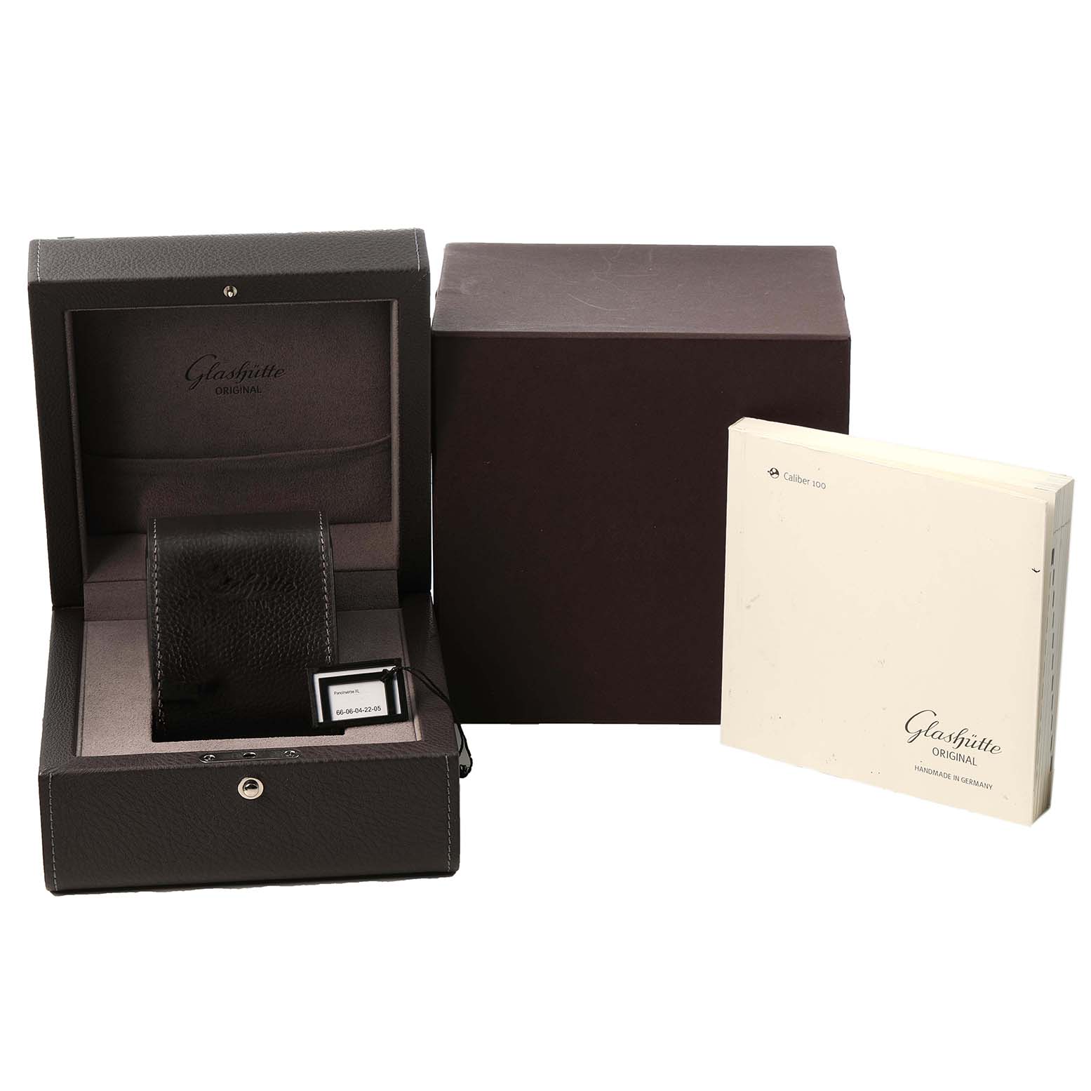 The image shows a Glashütte Pano model box, an outer box, and a manual displayed from a front angle.
