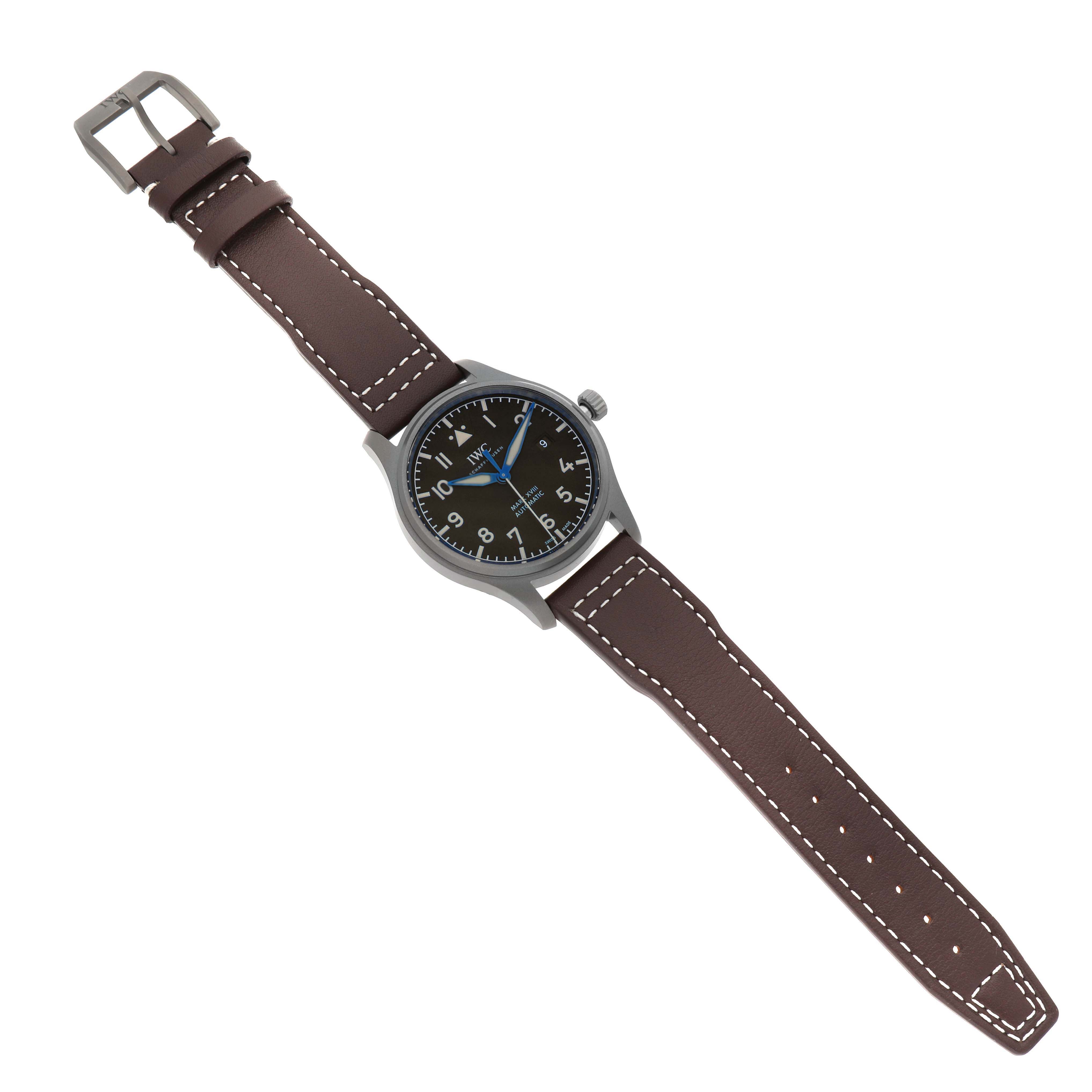 The IWC Pilot IW327006 Men's Titanium Black Dial watch is shown at a slight angle, displaying the full face, case, crown, and attached brown leather strap.