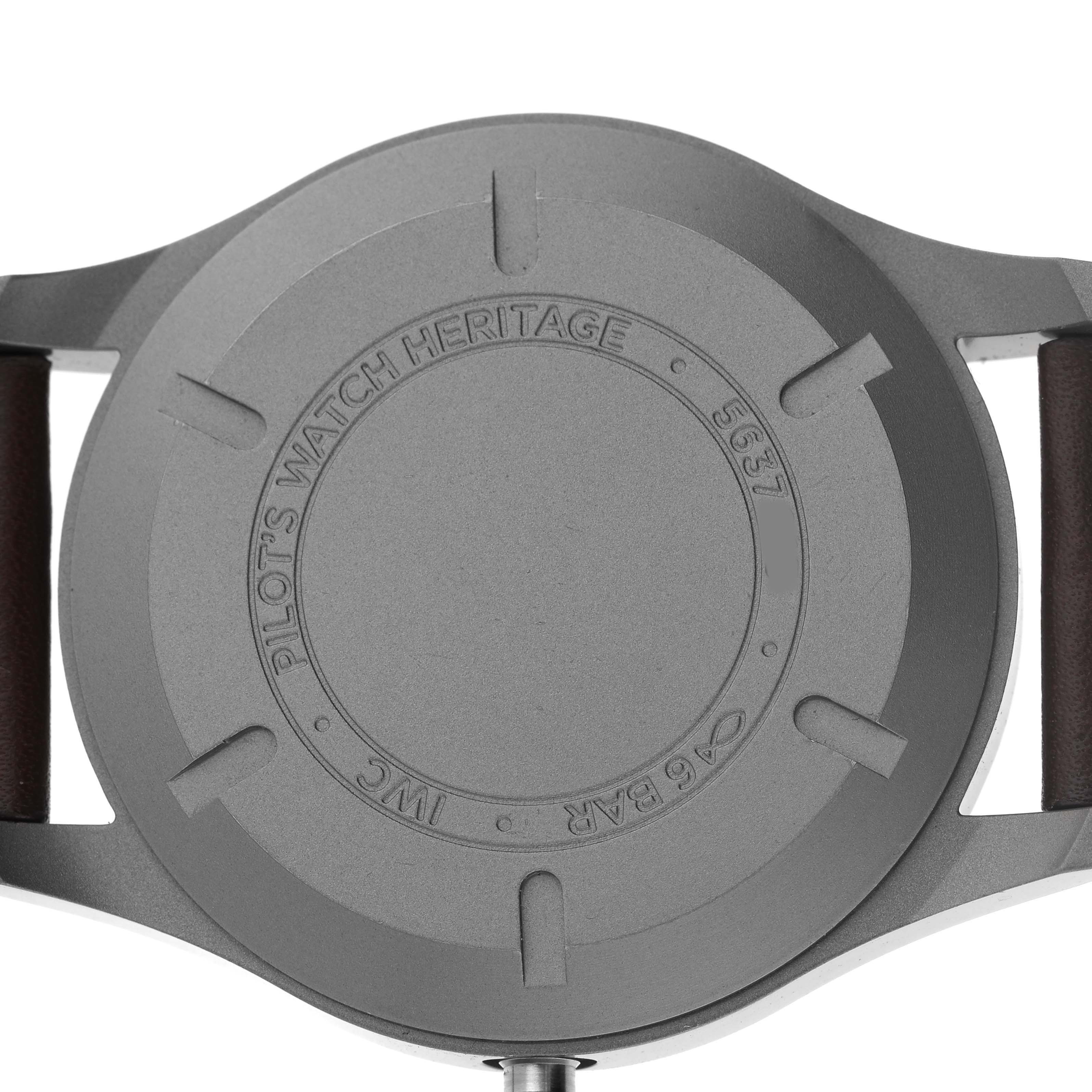 The image shows the back view of an IWC Pilot IW327006 Men's Titanium Black Dial's Watch, highlighting its caseback and brown strap ends.
