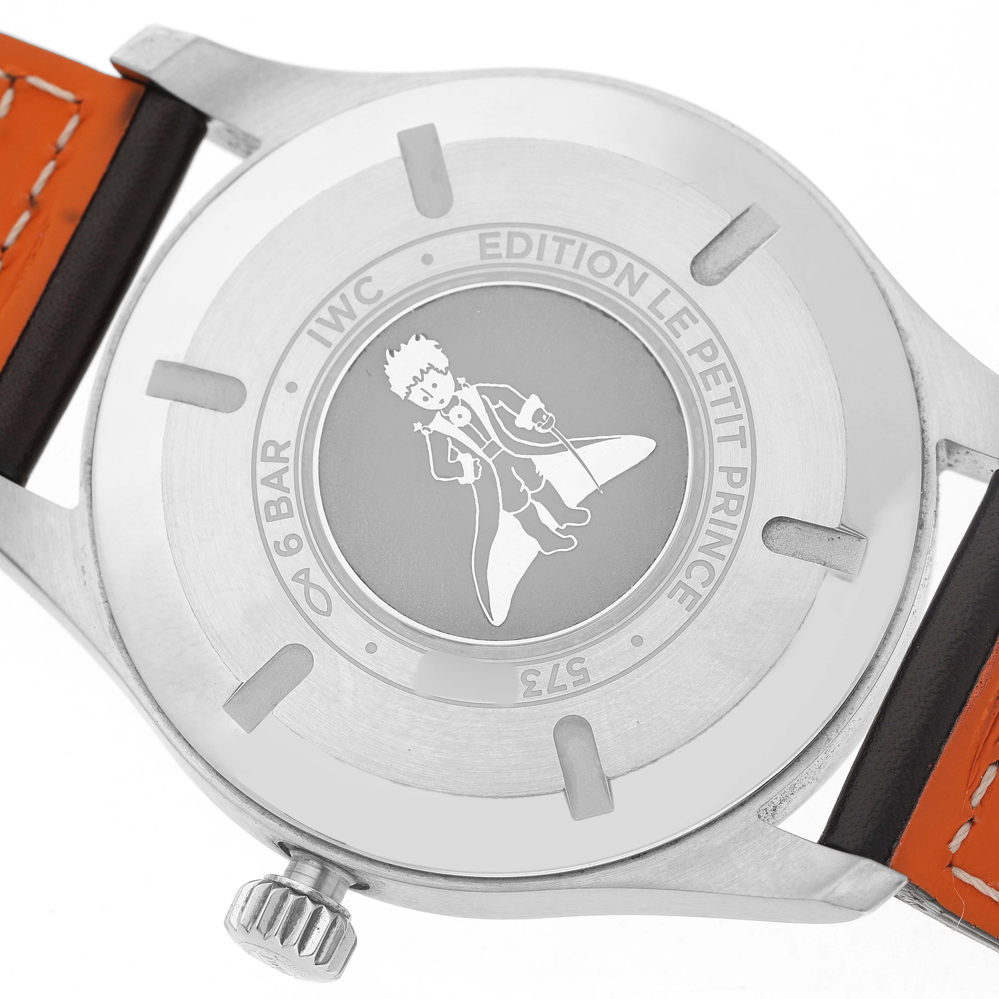 The image shows the case back of the IWC Pilot IW327010 Men's Stainless Steel Blue Dial model "Edition Le Petit Prince," depicting the character from the tale.