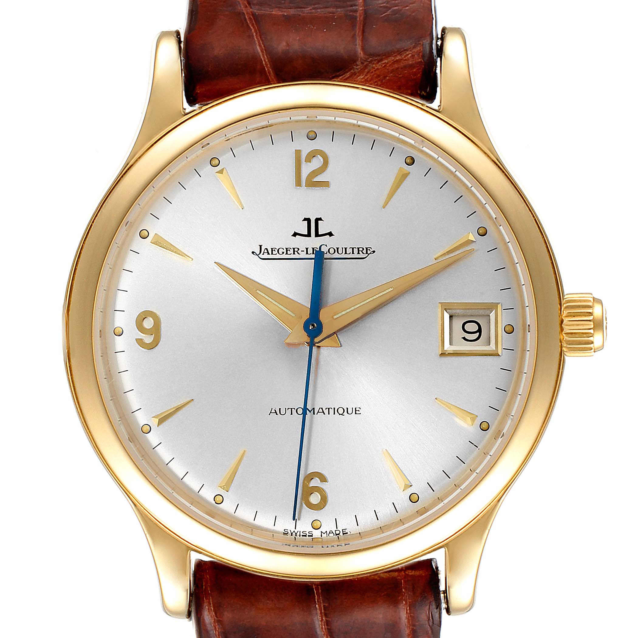 The image shows a Jaeger-LeCoultre Master model watch from a front angle, featuring a gold case, silver dial, date display, and brown leather strap.