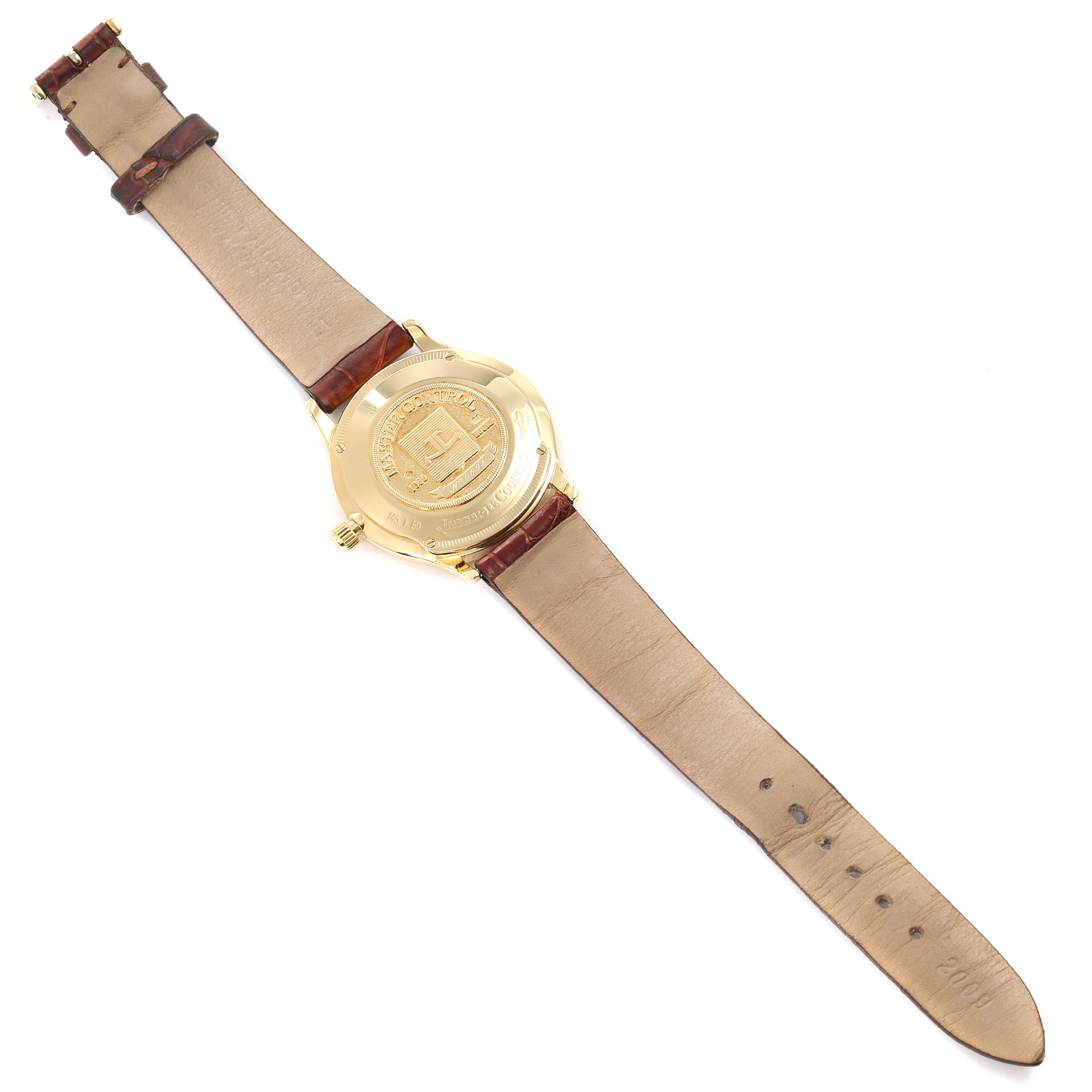 The image shows the back view of a Jaeger-LeCoultre Master model watch with its leather strap fully extended.