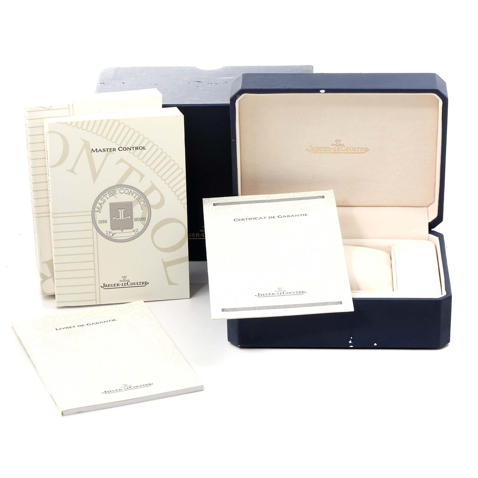 The image shows the packaging, manuals, and certificate for a Jaeger LeCoultre Master 145.1.89 Men's Yellow Gold Silver Dial 145.1.89 Men's Yellow Gold Silver Dial model watch, with the watch box open.