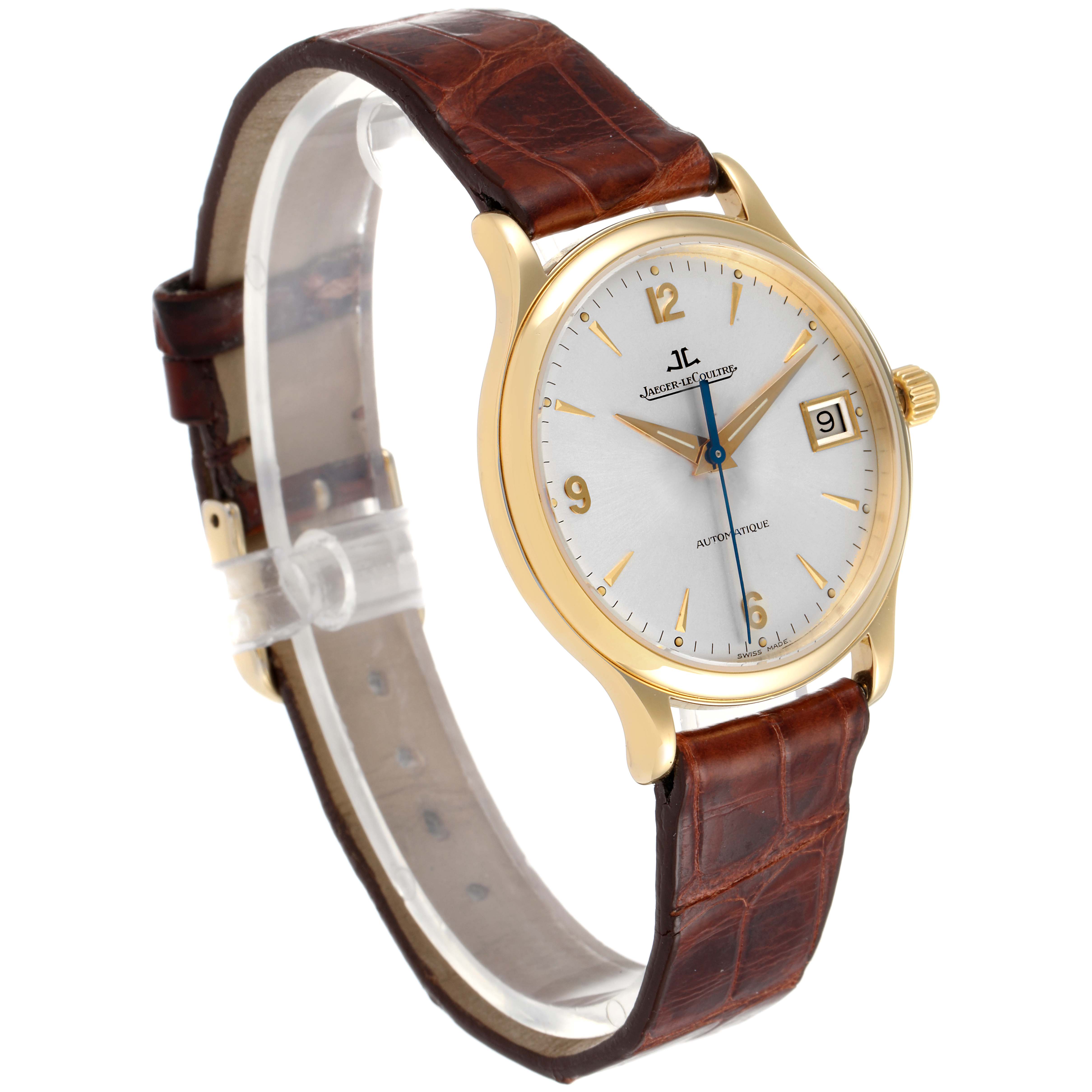 This Jaeger LeCoultre Master 145.1.89 Men's Yellow Gold Silver Dial 145.1.89 Men's Yellow Gold Silver Dial model watch is shown at a three-quarter angle, highlighting the dial, case, and leather strap.