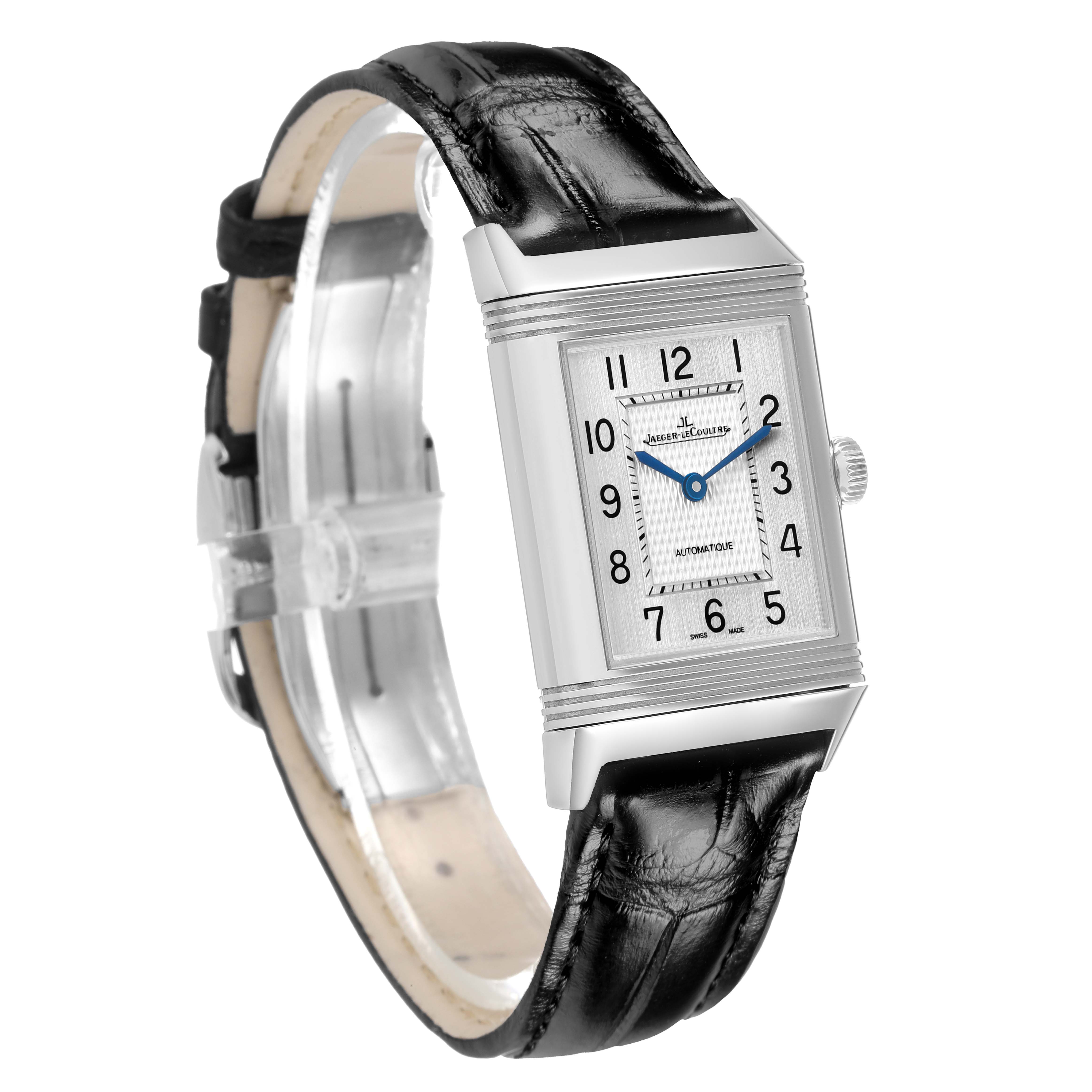 The Jaeger-LeCoultre Reverso watch is shown at a three-quarter angle, highlighting the face, crown, and leather strap.