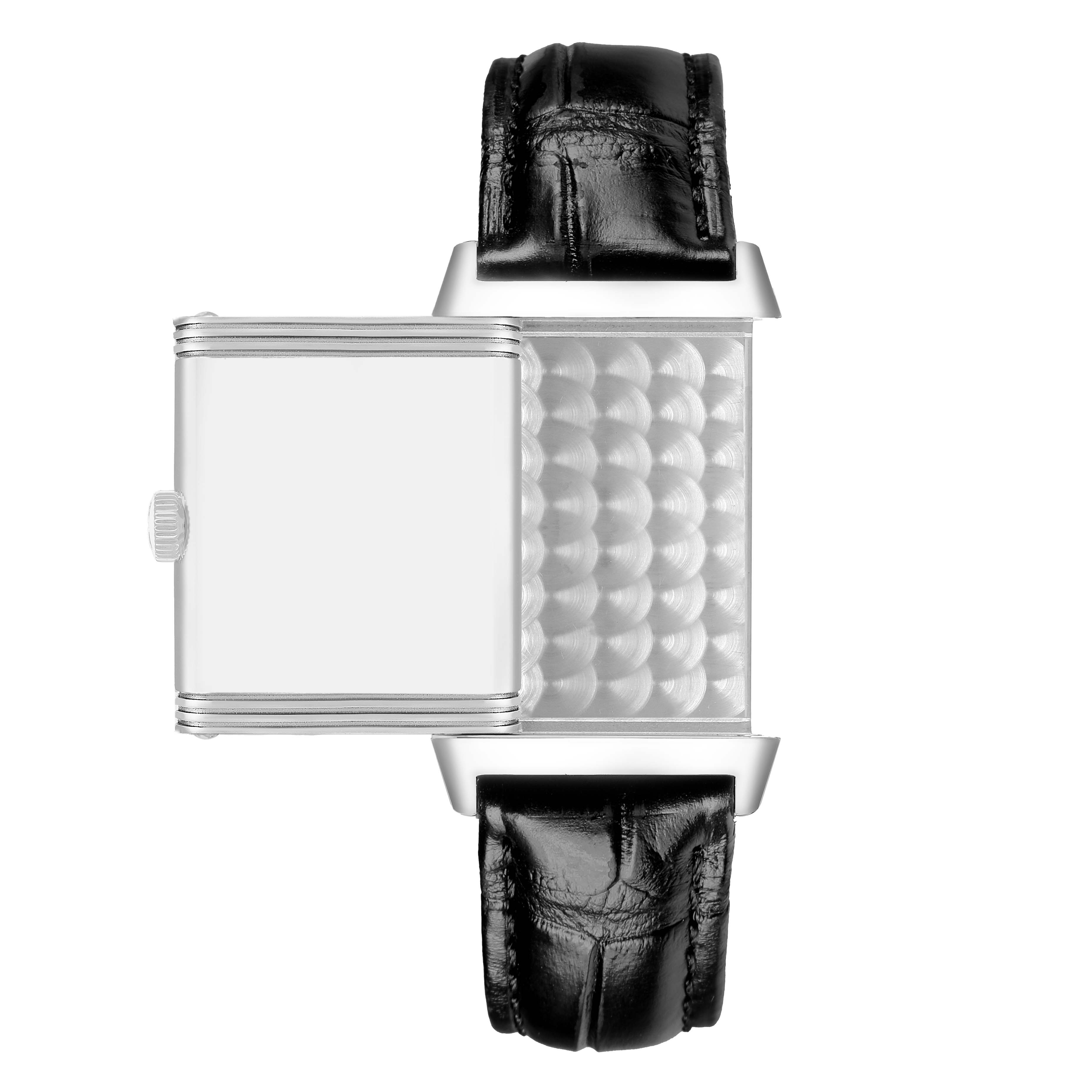 The Jaeger-LeCoultre Reverso watch is shown fully reversed, displaying the back panel and black leather straps.
