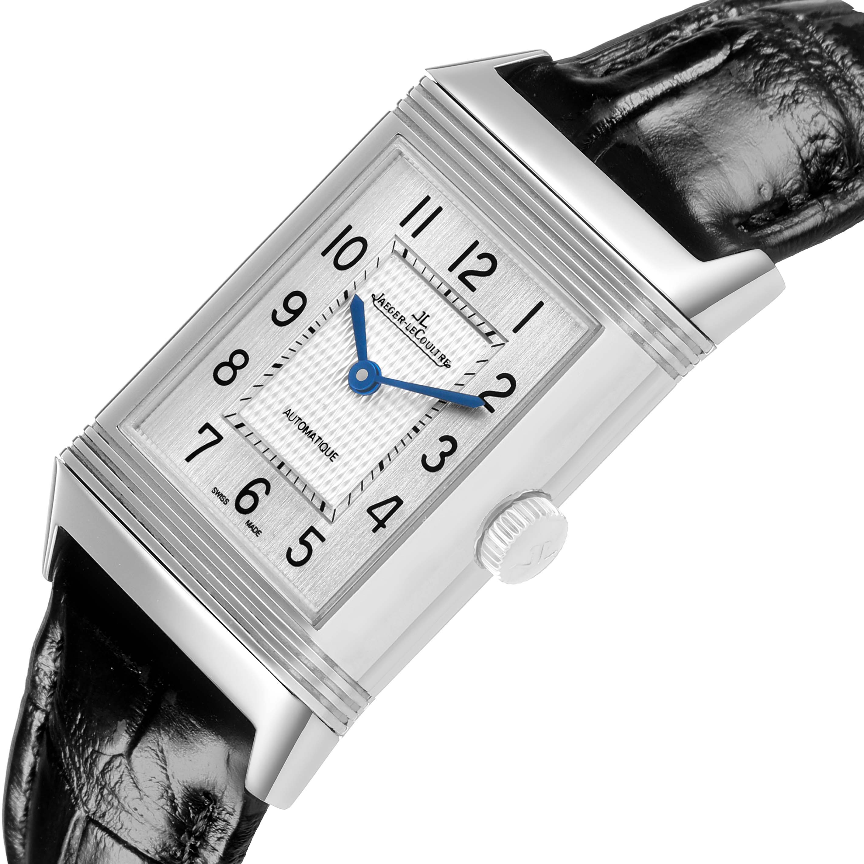 The Jaeger LeCoultre Reverso Q2538420 Men's Stainless Steel Silver Dial watch is shown at an angled side view, highlighting the rectangular face, blue hands, and crown.