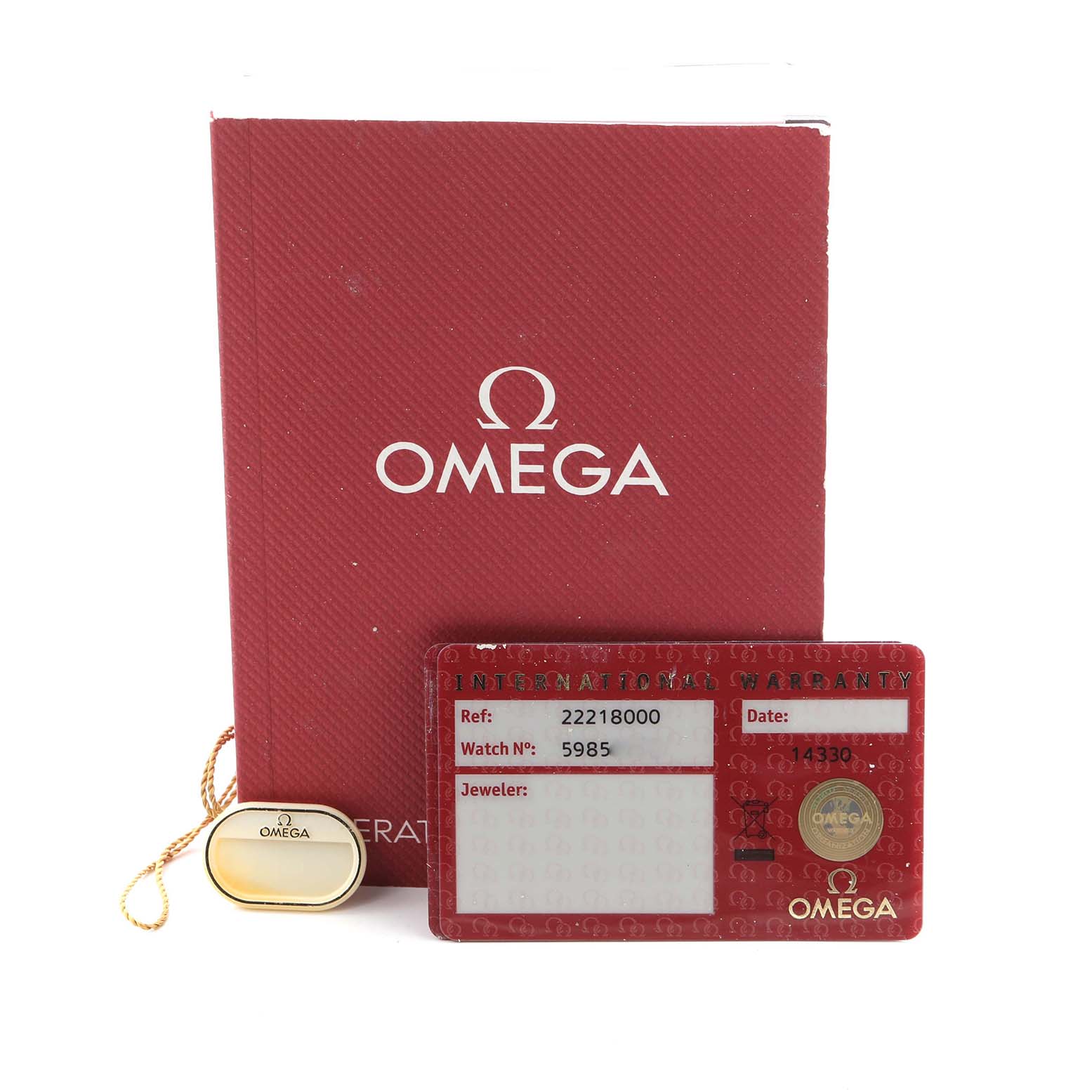 The image shows Omega Seamaster 2221.80.00 Men
s Stainless Steel Blue Dial 2221.80.00 Men
s Stainless Steel Blue Dial accessories, including a red warranty card, a booklet, and a gold tag.