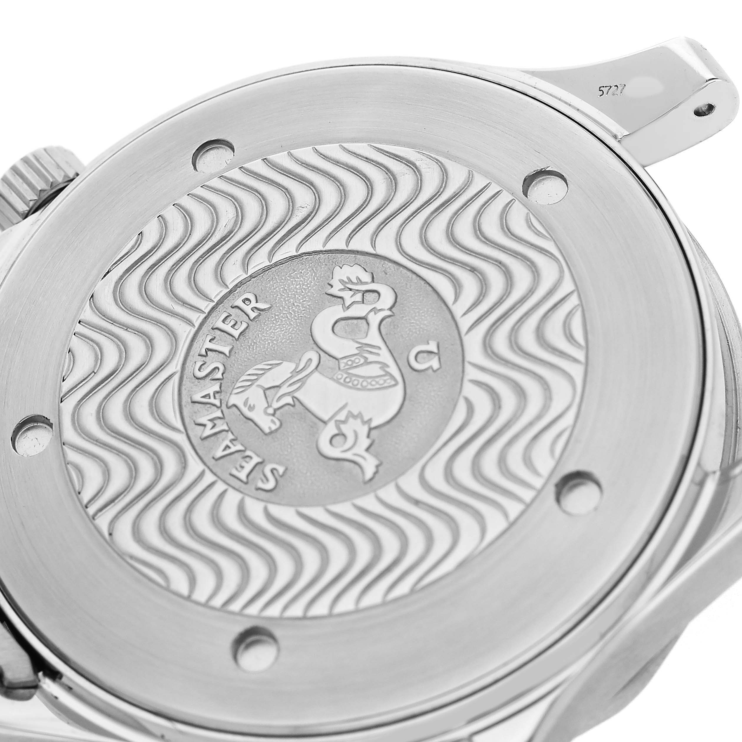 The image shows the back case of an Omega Seamaster 2264.50.00 Men's Stainless Steel Black Dial watch with its engraved logo and wave pattern.