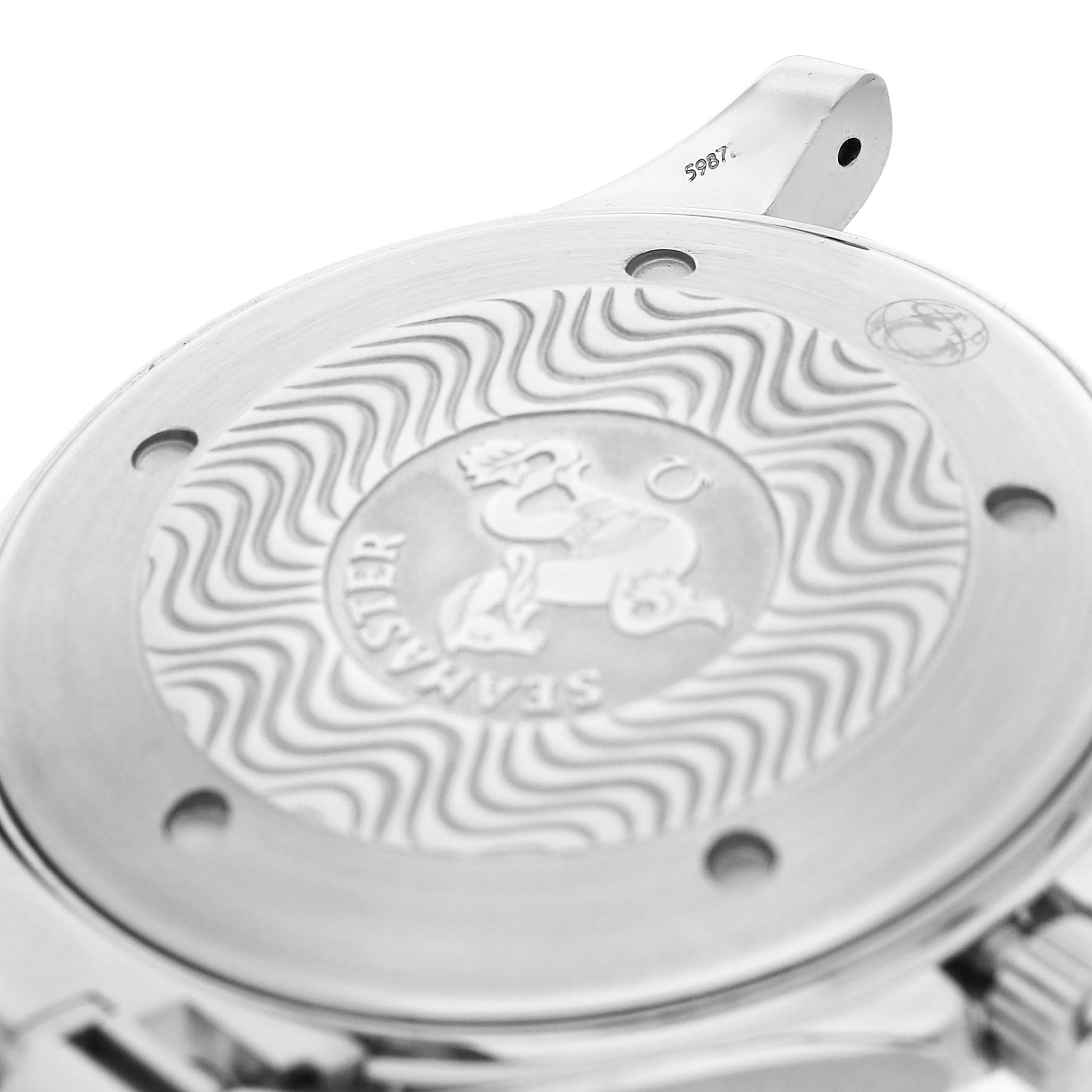 The image shows the back case of an Omega Seamaster 2265.80.00 Men's Stainless Steel Blue Dial watch, featuring the engraved emblem and wave pattern.