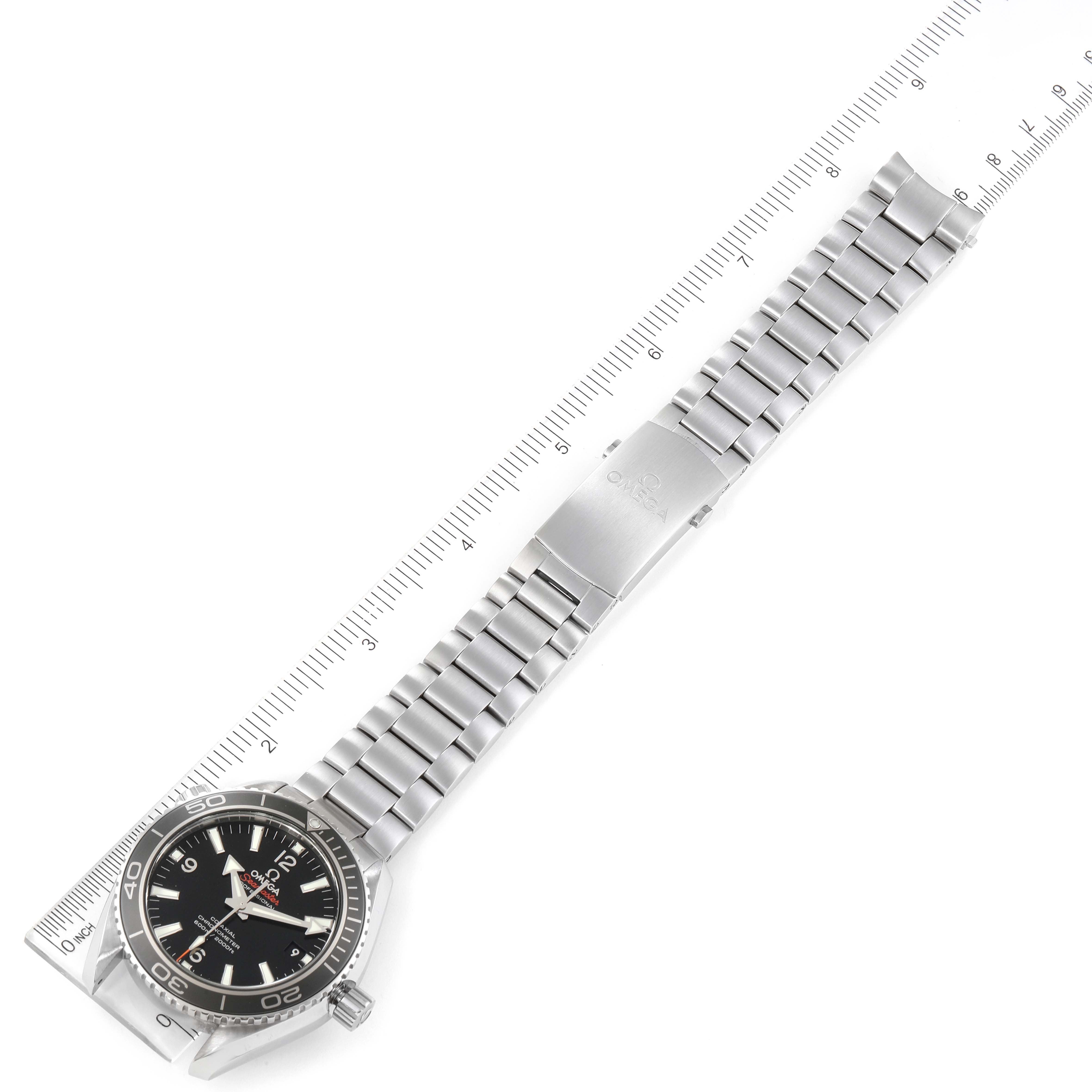 The image shows an overhead view of an Omega Planet Ocean 232.30.42.21.01.003 Men
s Stainless Steel Black Dial 232.30.42.21.01.003 Men
s Stainless Steel Black Dial watch, displaying the face, bezel, and full stainless steel bracelet.