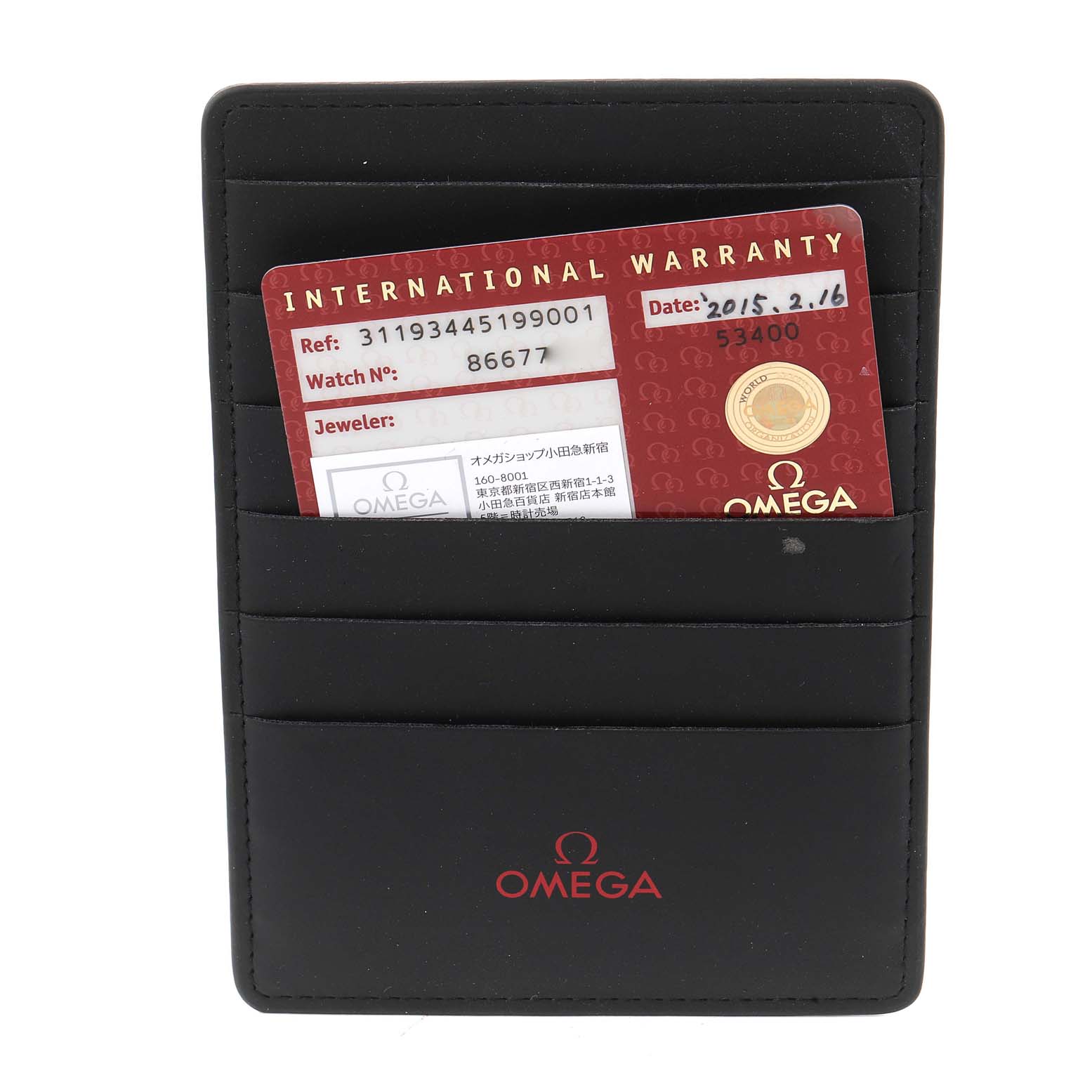 The image shows the international warranty card and a black Omega cardholder for the Speedmaster model.