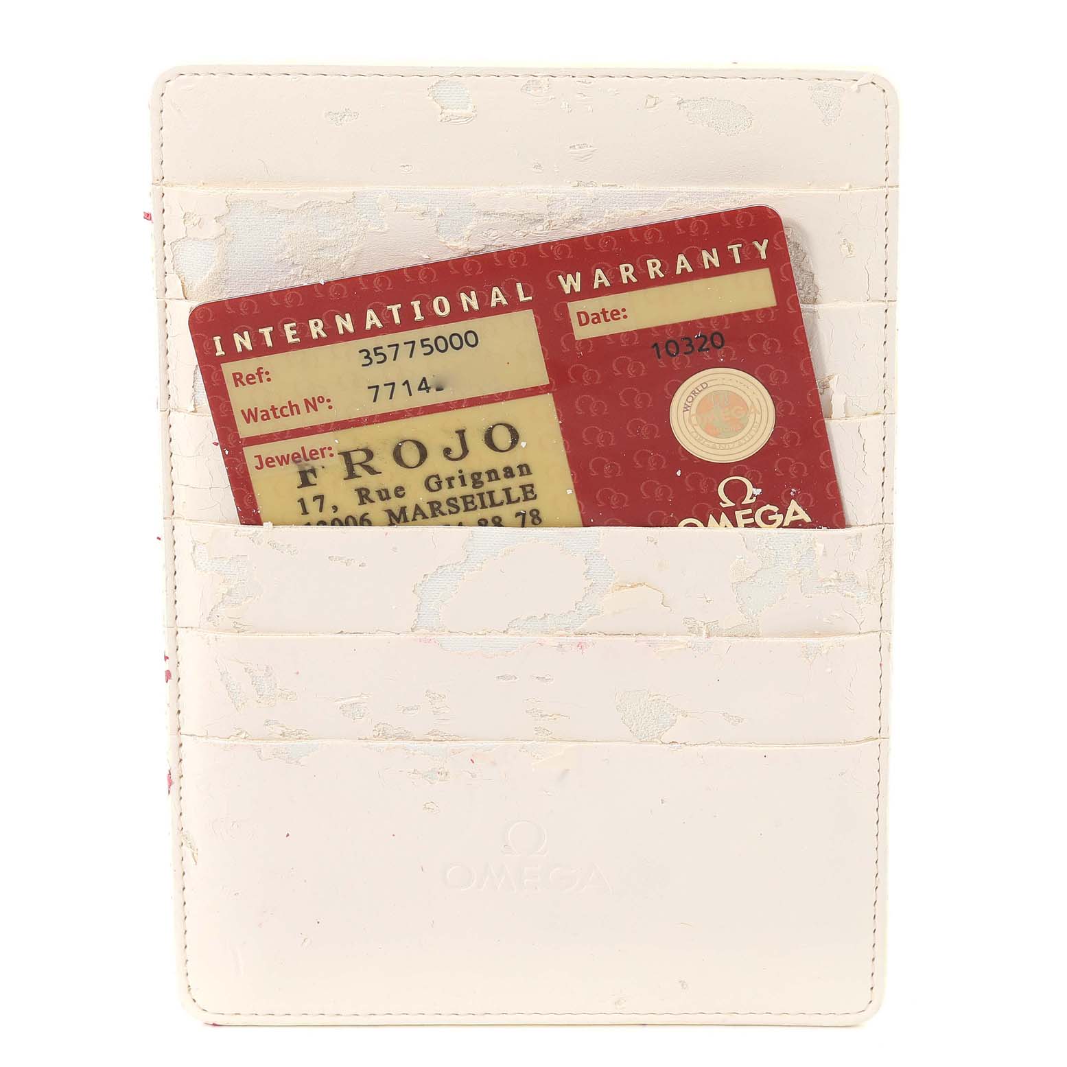 The image shows an Omega Speedmaster 3577.50.00 Men's Stainless Steel Black Dial 3577.50.00 Men's Stainless Steel Black Dial International Warranty card in a white cardholder.