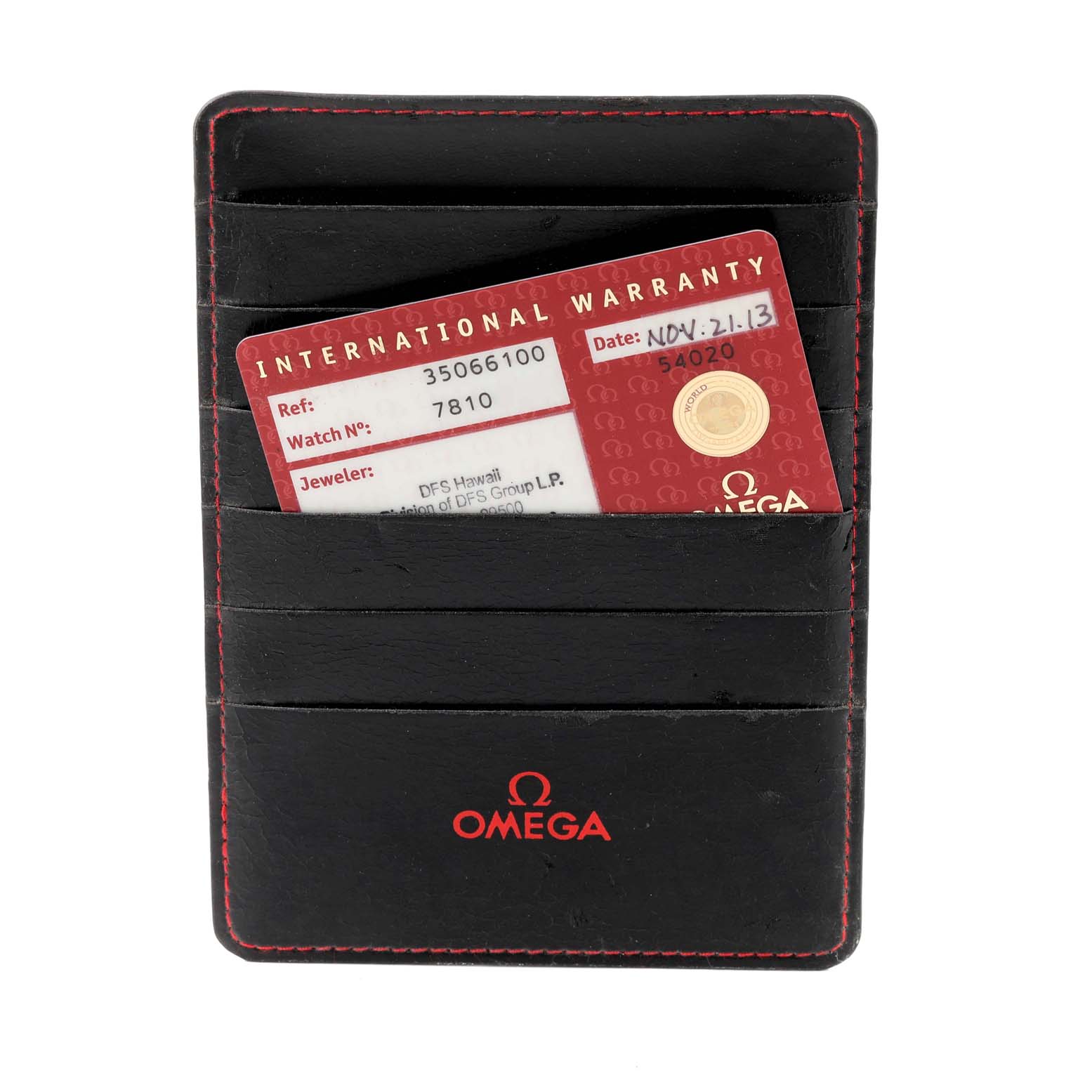 This image shows an Omega Speedmaster 3506.61.00 Men's Stainless Steel Red Dial 3506.61.00 Men's Stainless Steel Red Dial warranty card in a black leather cardholder with red stitching.