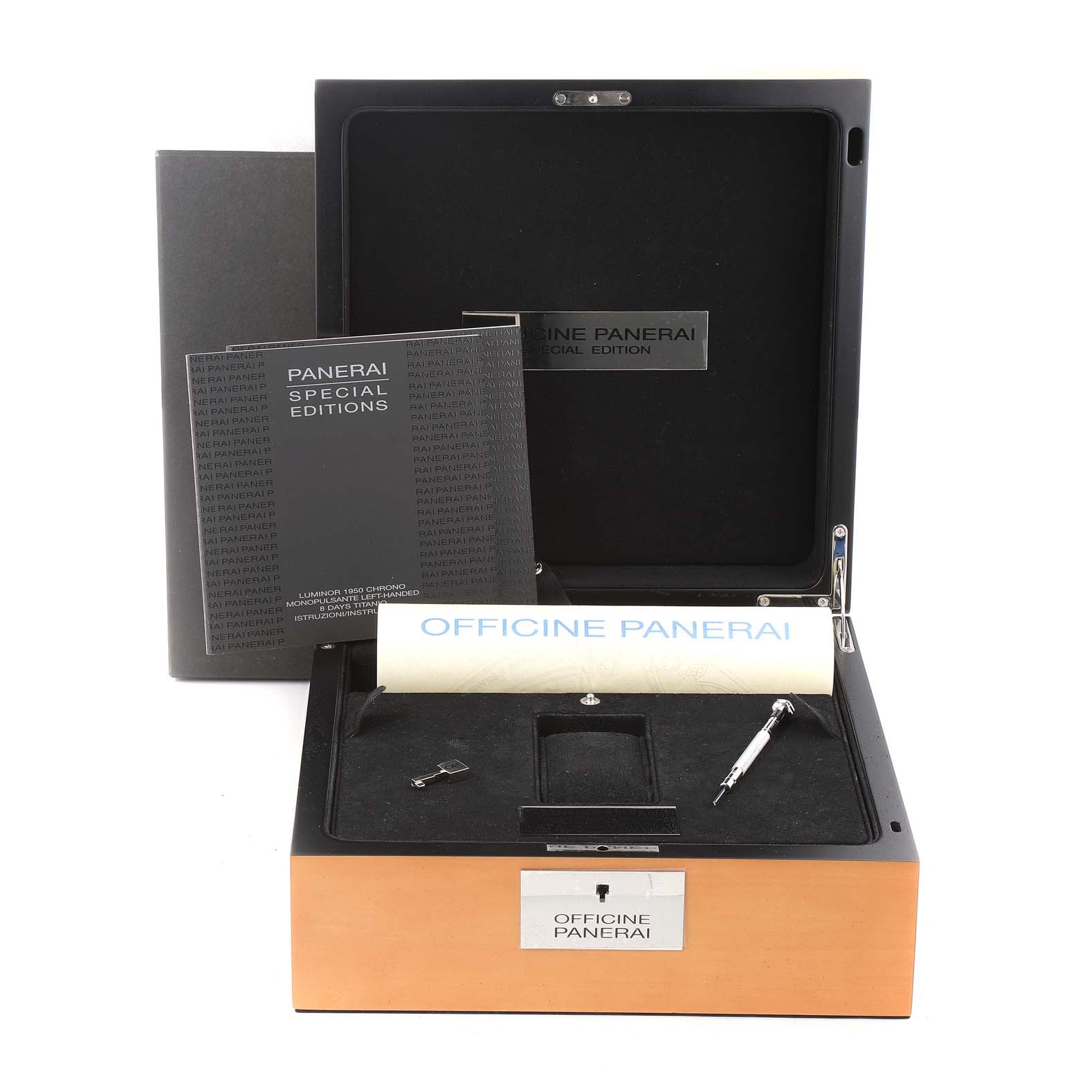 The image shows a boxed set of Panerai Luminor PAM00345 Men's Titanium Black Dial PAM00345 Men's Titanium Black Dial watch accessories, including booklets, a strap tool, and spare parts.