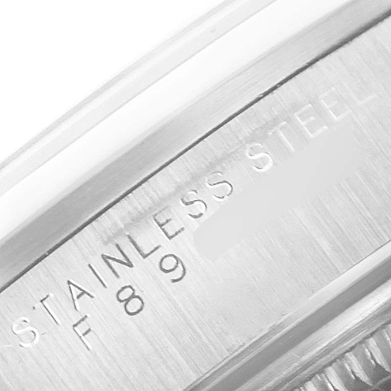 This image shows a close-up of the stainless steel casing with engravings on a Rolex Air-King 14000 Men's Stainless Steel Black Dial 14000 Men's Stainless Steel Black Dial watch.