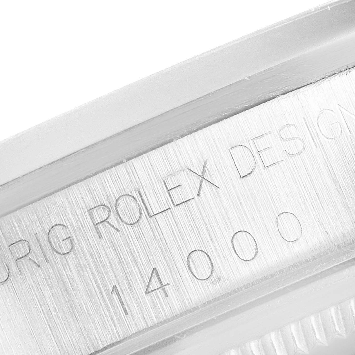 This close-up shows the engraved model number and design inscriptions on the side of a Rolex Air-King 14000 Men's Stainless Steel Pink Dial 14000 Men's Stainless Steel Pink Dial watch case.