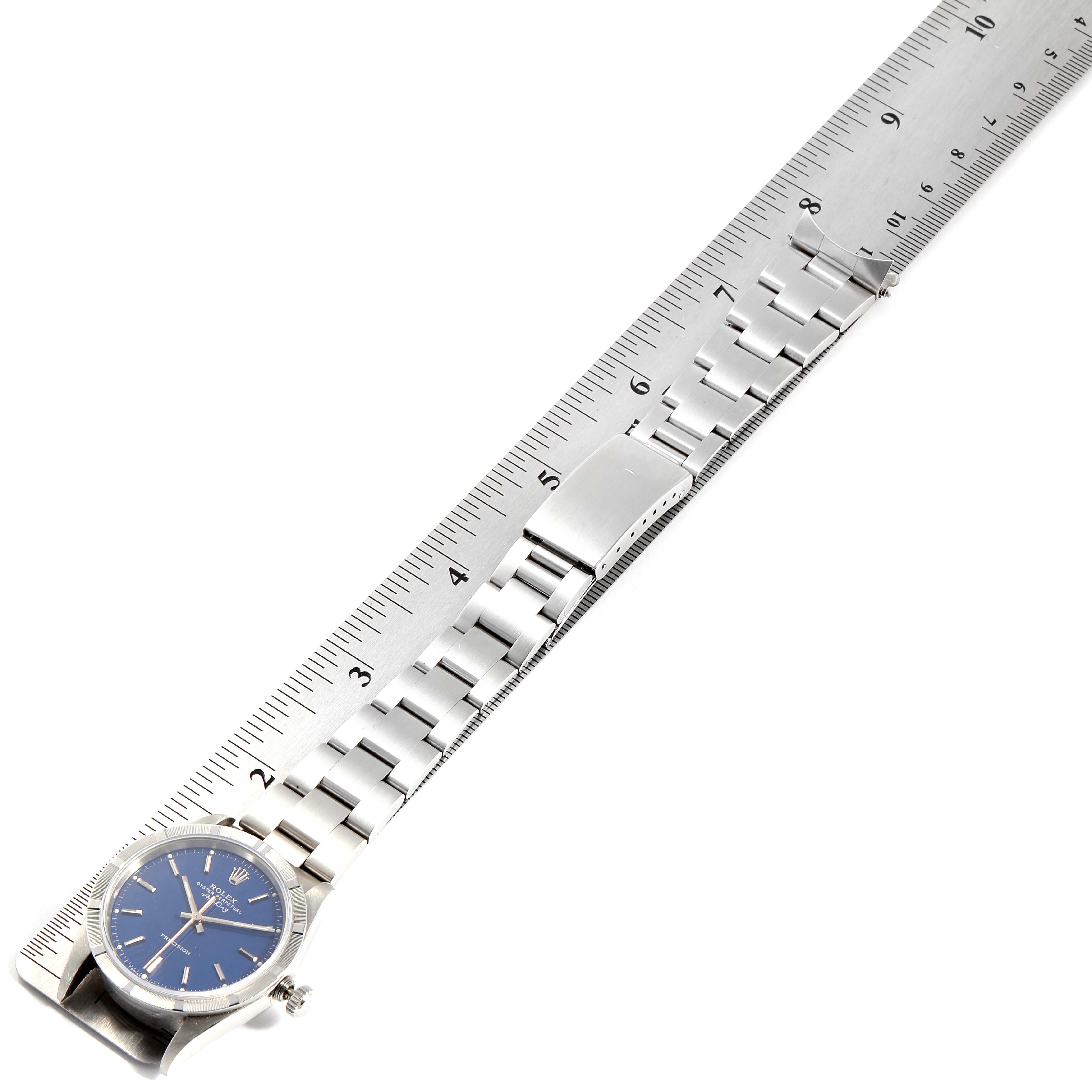 The watch displayed is a Rolex Air-King 14010 Men's Stainless Steel Blue Dial 14010 Men's Stainless Steel Blue Dial model, shown from the face down to the clasp, placed along a ruler.