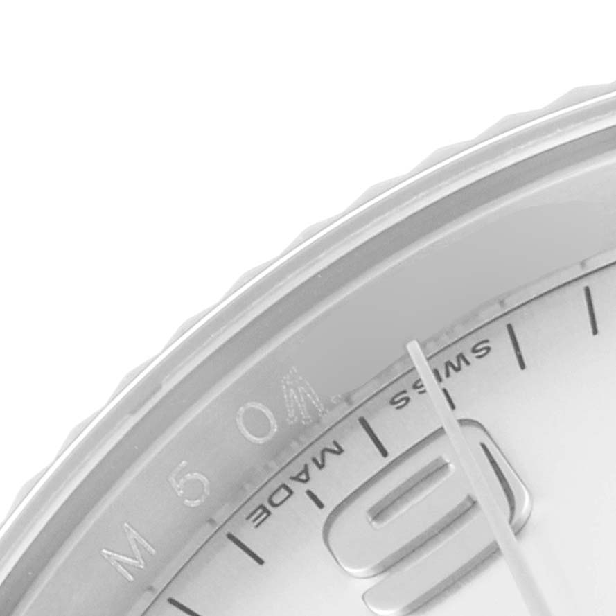 The image shows a close-up of the Rolex Air-King 114234 Men's Stainless Steel Silver Dial 114234 Men's Stainless Steel Silver Dial watch dial with part of the bezel, minute markers, and the number "9."