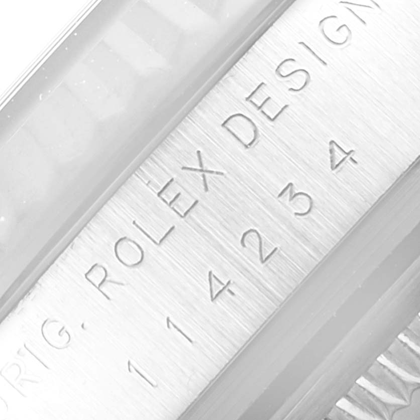 This image shows a close-up of the engraved reference number "114234" and "ROLEX DESIGN" on the case of a Rolex Air-King 114234 Men's Stainless Steel Silver Dial 114234 Men's Stainless Steel Silver Dial watch.