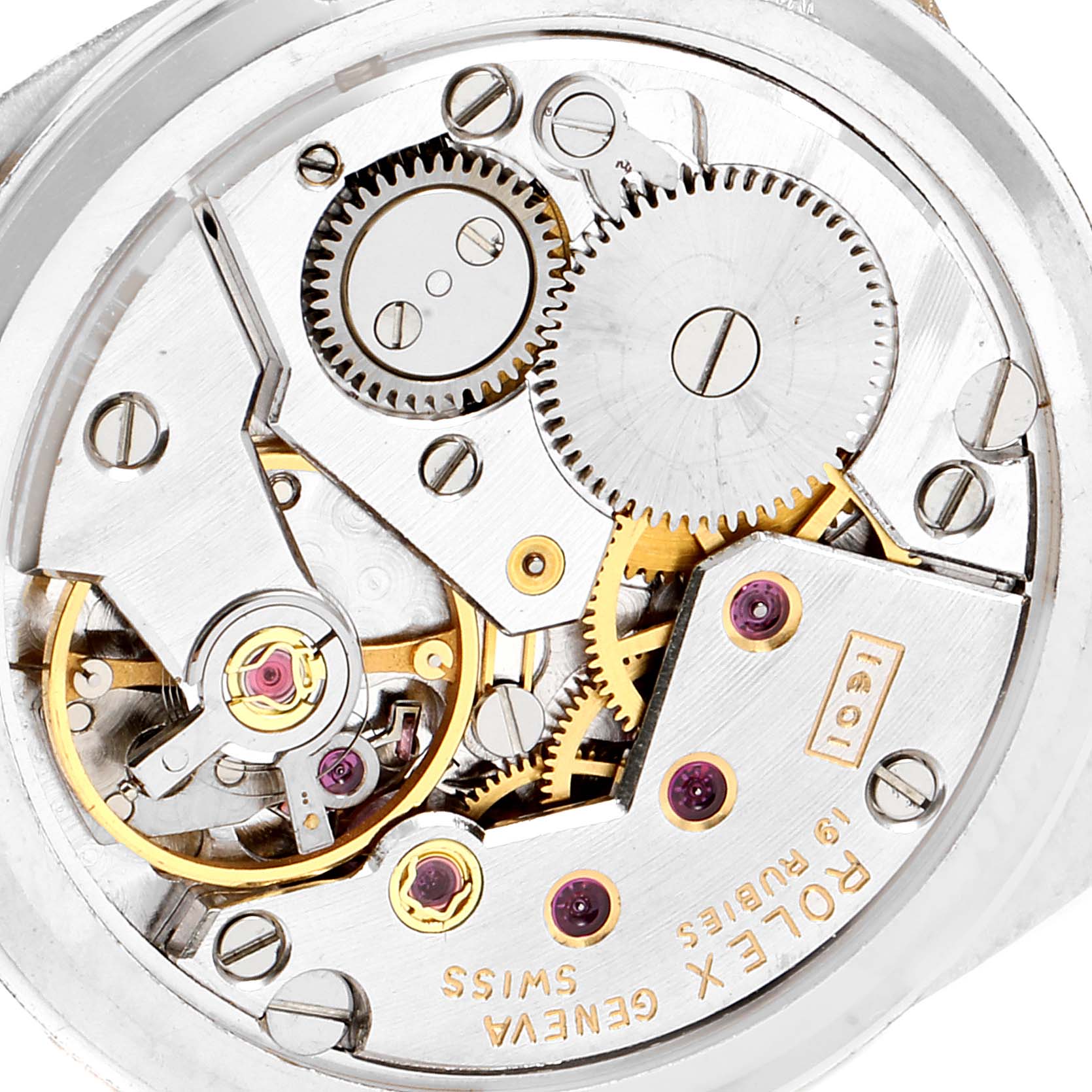 This image shows the internal mechanism of the Vintage Collection watch by Rolex, focusing on the intricate gears and movement.