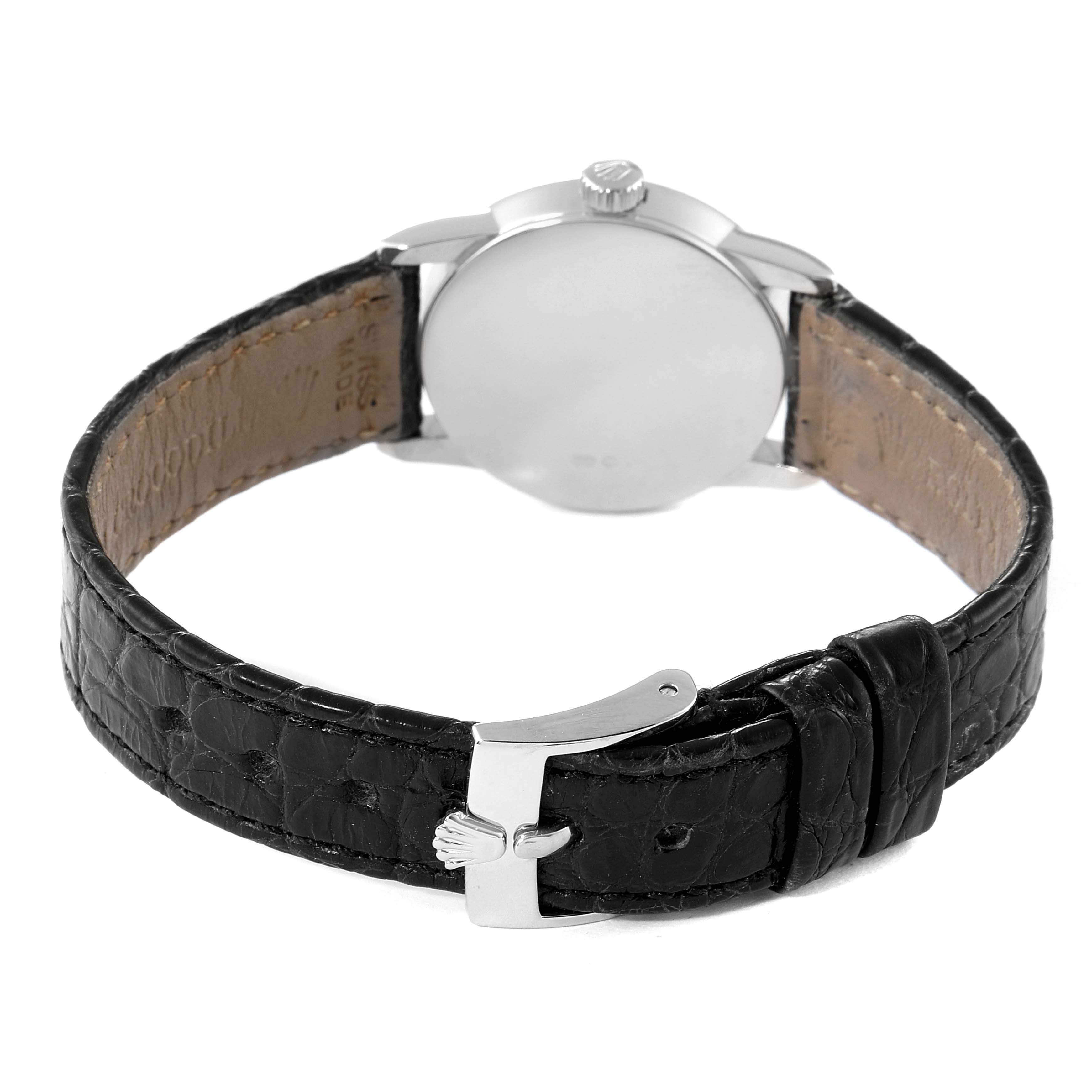 The image shows the back of a Rolex Cellini 6111 Women's White Gold Grey Dial 6111 Women's White Gold Grey Dial watch, focusing on the case back and black leather strap with a clasp.