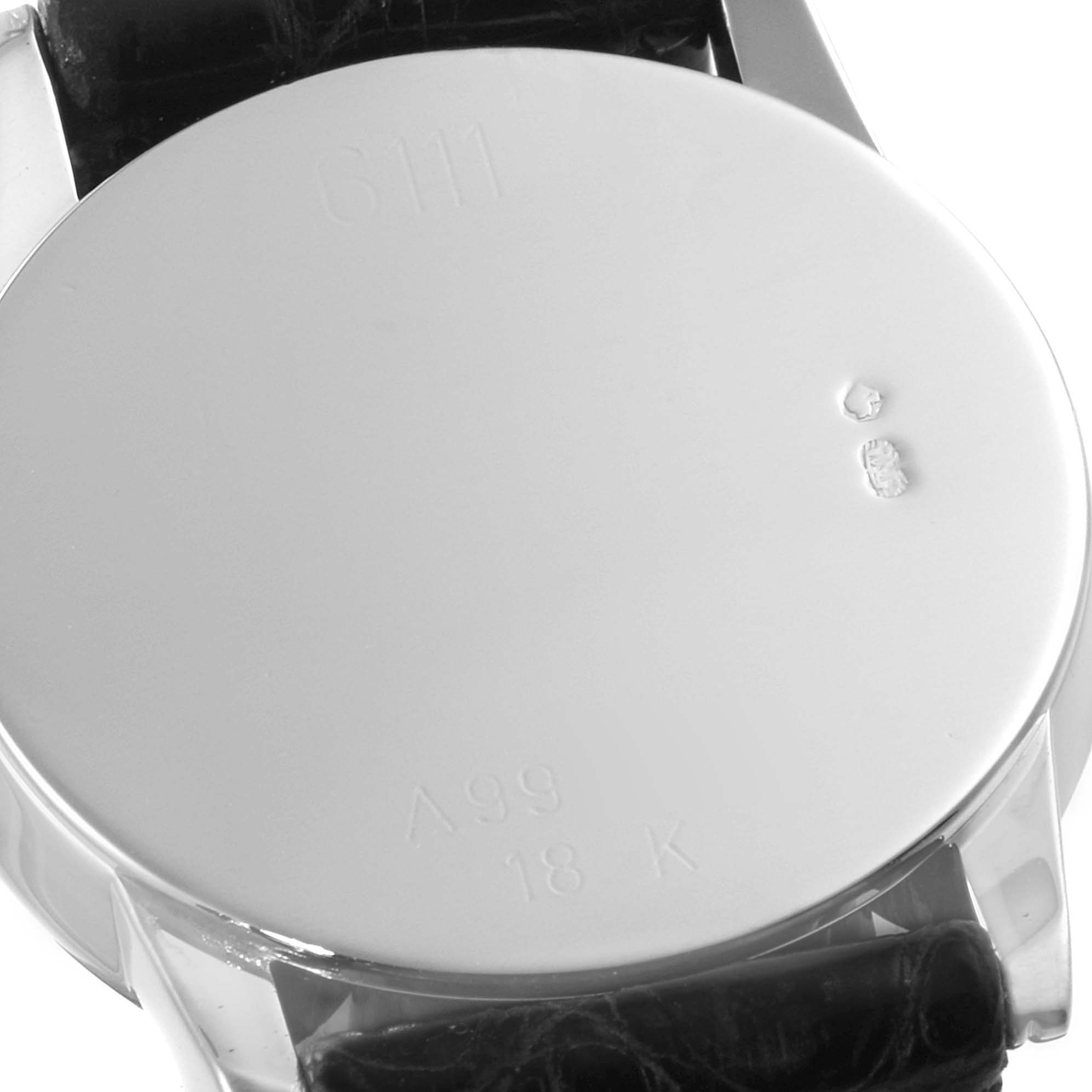 The image shows the back case of a Rolex Cellini 6111 Women's White Gold Grey Dial 6111 Women's White Gold Grey Dial watch, focusing on its markings and leather strap.