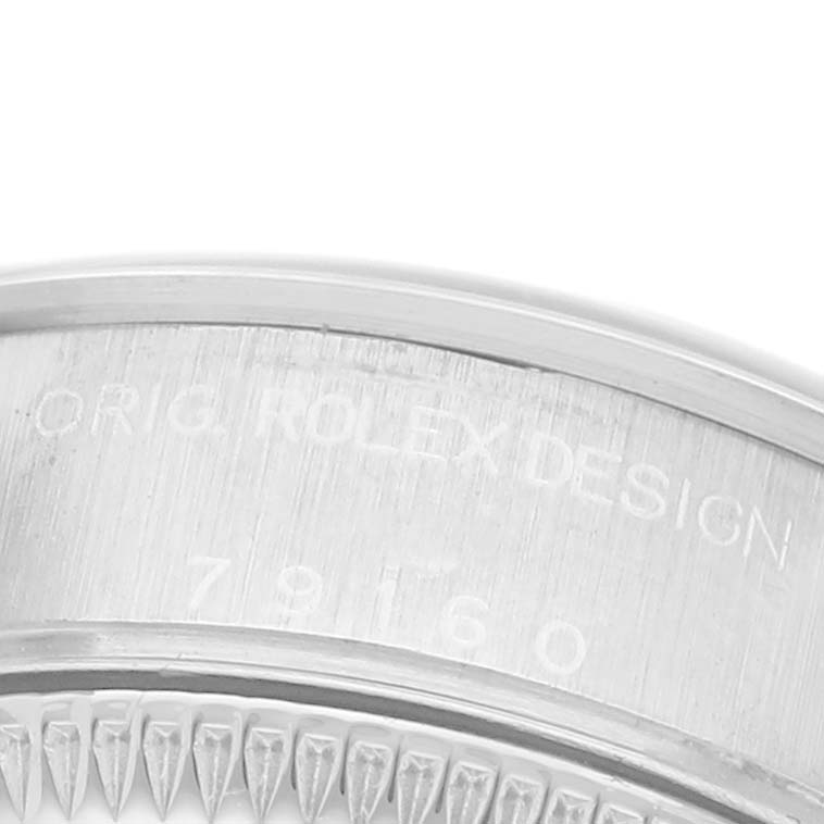 The image shows an angled close-up of the Date model by Rolex, focusing on the engraved case edge and bezel.